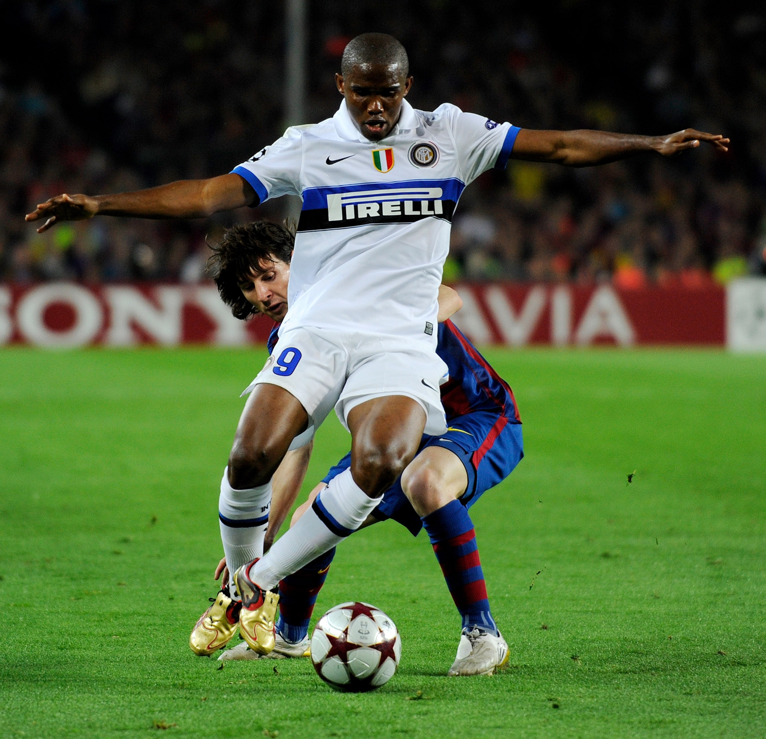 BARCELONA, SPAIN - APRIL 28: Samuel Eto'o of Inter Milan is challenged by Lionel Messi of Barcelona during the UEFA Champions League Semi Final Second Leg match between Barcelona and Inter Milan at Camp Nou on April 28, 2010 in Barcelona, Spain.  (Photo b