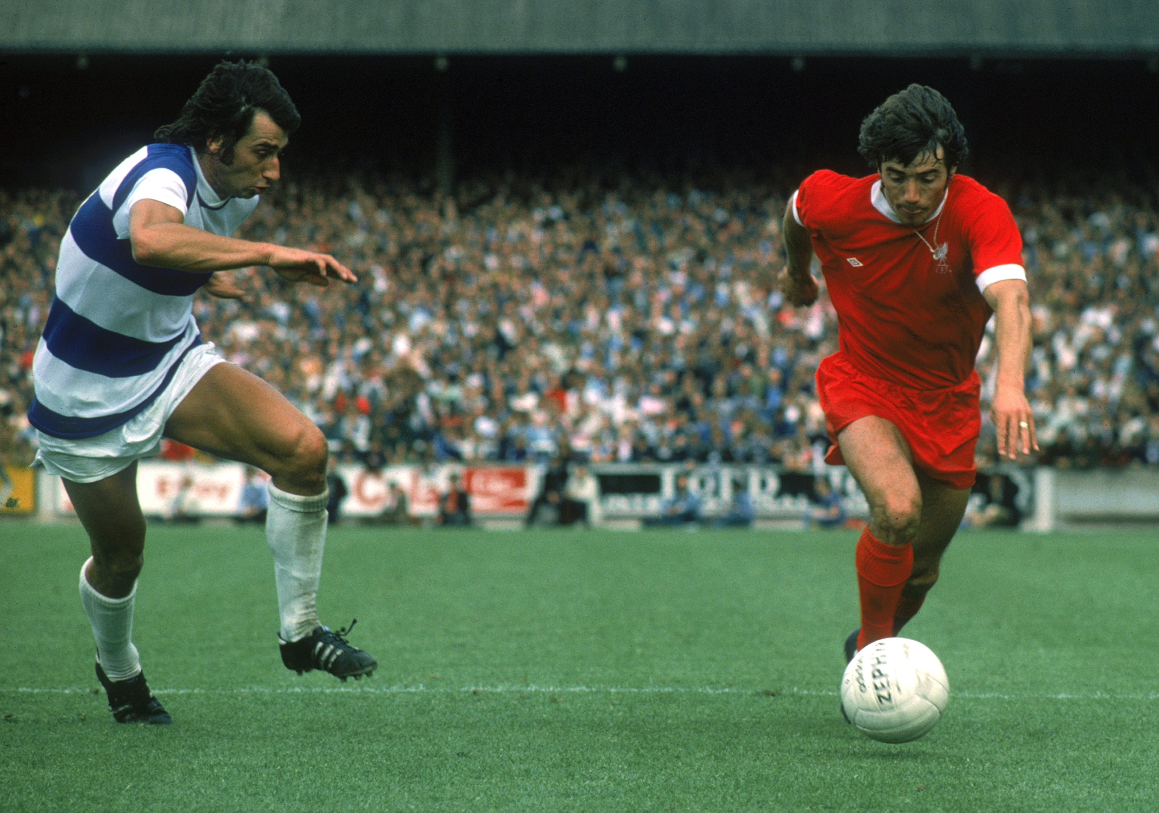 LONDON - AUGUST 16: Kevin Keegan of Liverpool looks to take the ball past Dave Clement of Queens Park Rangers during the League Division One match held on August 16, 1975 at Loftus Road, in London. Queens Park Rangers won the match 2-0. (Photo by Don Mor LONDON - AUGUST 16: Kevin Keegan of Liverpool looks to take the ball past Dave Clement of Queens Park Rangers during the League Division One match held on August 16, 1975 at Loftus Road, in London. Queens Park Rangers won the match 2-0. (Photo by Don Mor