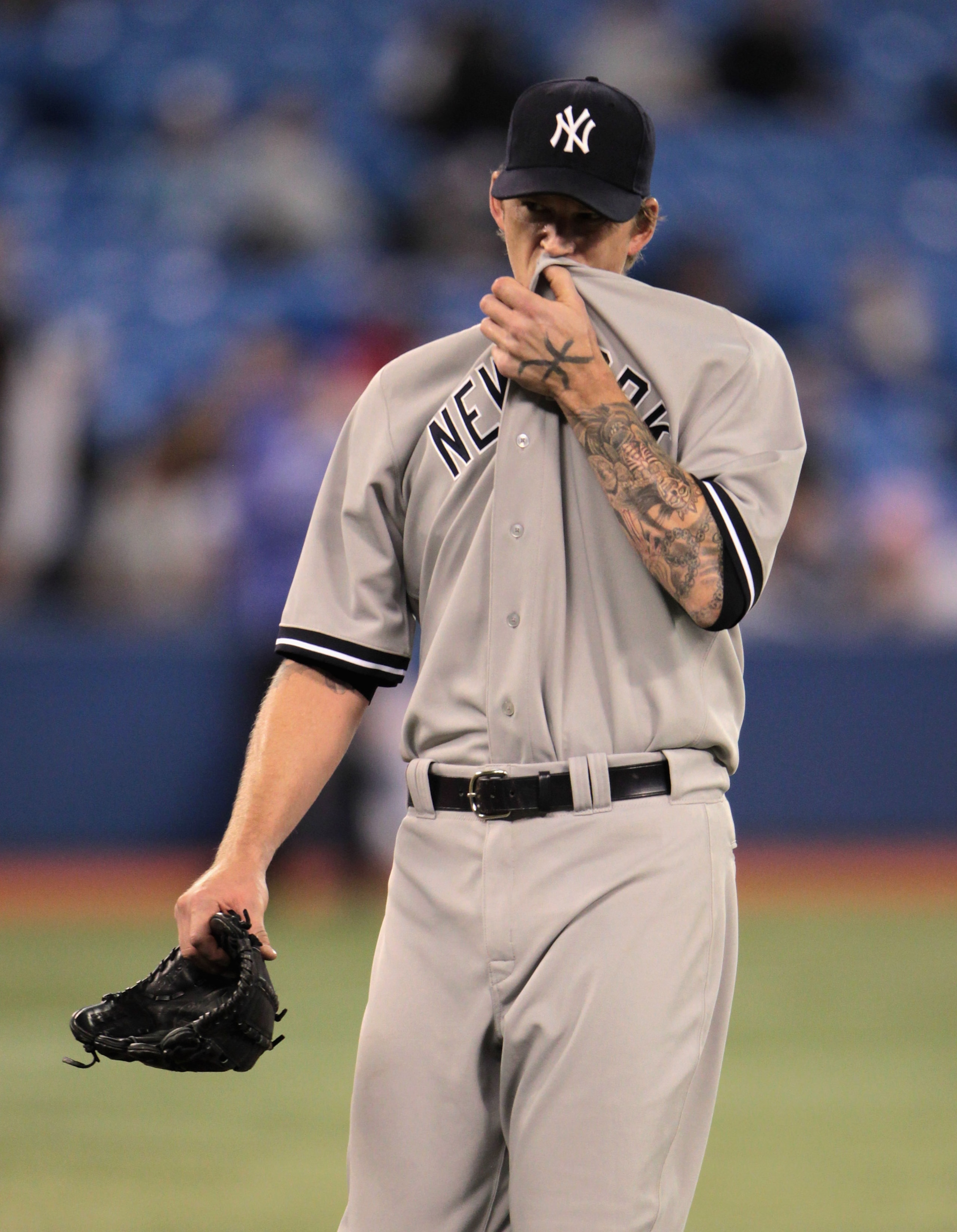TORONTO, ON - APRIL 19:  A.J. Burnett #34 of the New York Yankees walks to the dugout after being pulled in the sixth inning during their game against the Toronto Blue Jays at Rogers Centre on April 19, 2011 in Toronto, Canada.  (Photo by Scott Halleran/G