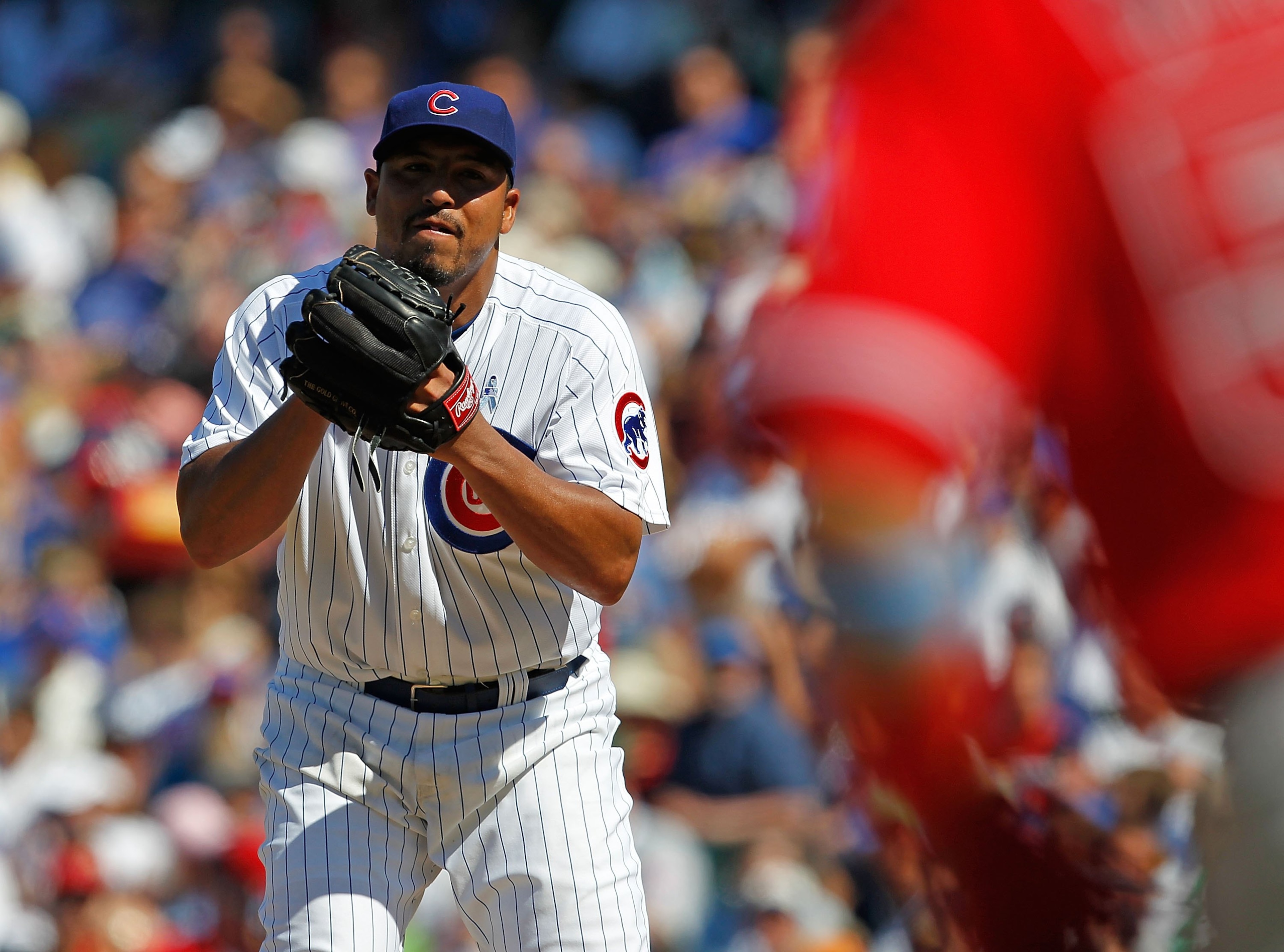 CHICAGO - JUNE 20: Carlos Zambrano #38 of the Chicago Cubs looks at a runner from the Los Angeles Angels of Anaheim at third base before pitching at Wrigley Field on June 20, 2010 in Chicago, Illinois. The Cubs defeated the Angels 12-1. (Photo by Jonathan