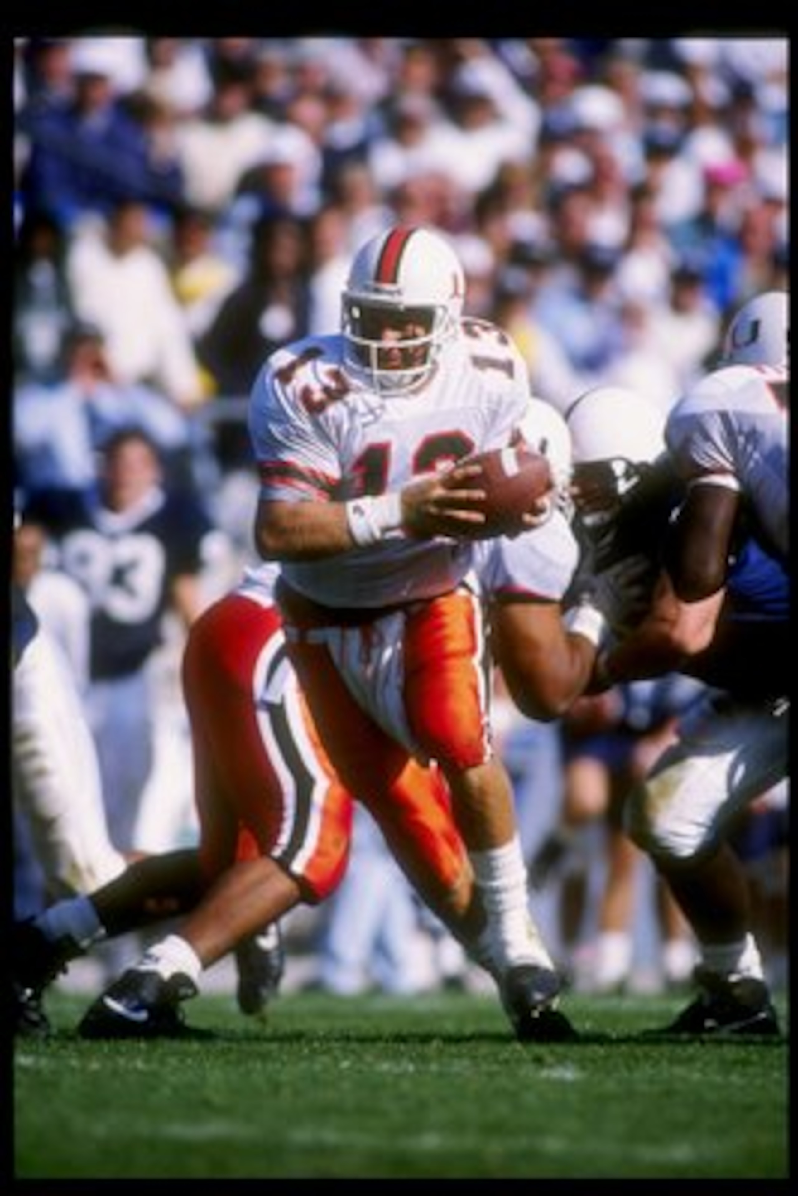10 Oct 1992:  Quarterback Gino Torretta of the Miami Hurricanes drops back during a game against the Penn State Nittany Lions at Beaver Stadium in University Park, Pennsylvania.  Miami won the game 17-14. Mandatory Credit: Gene Sweeney  /Allsport
