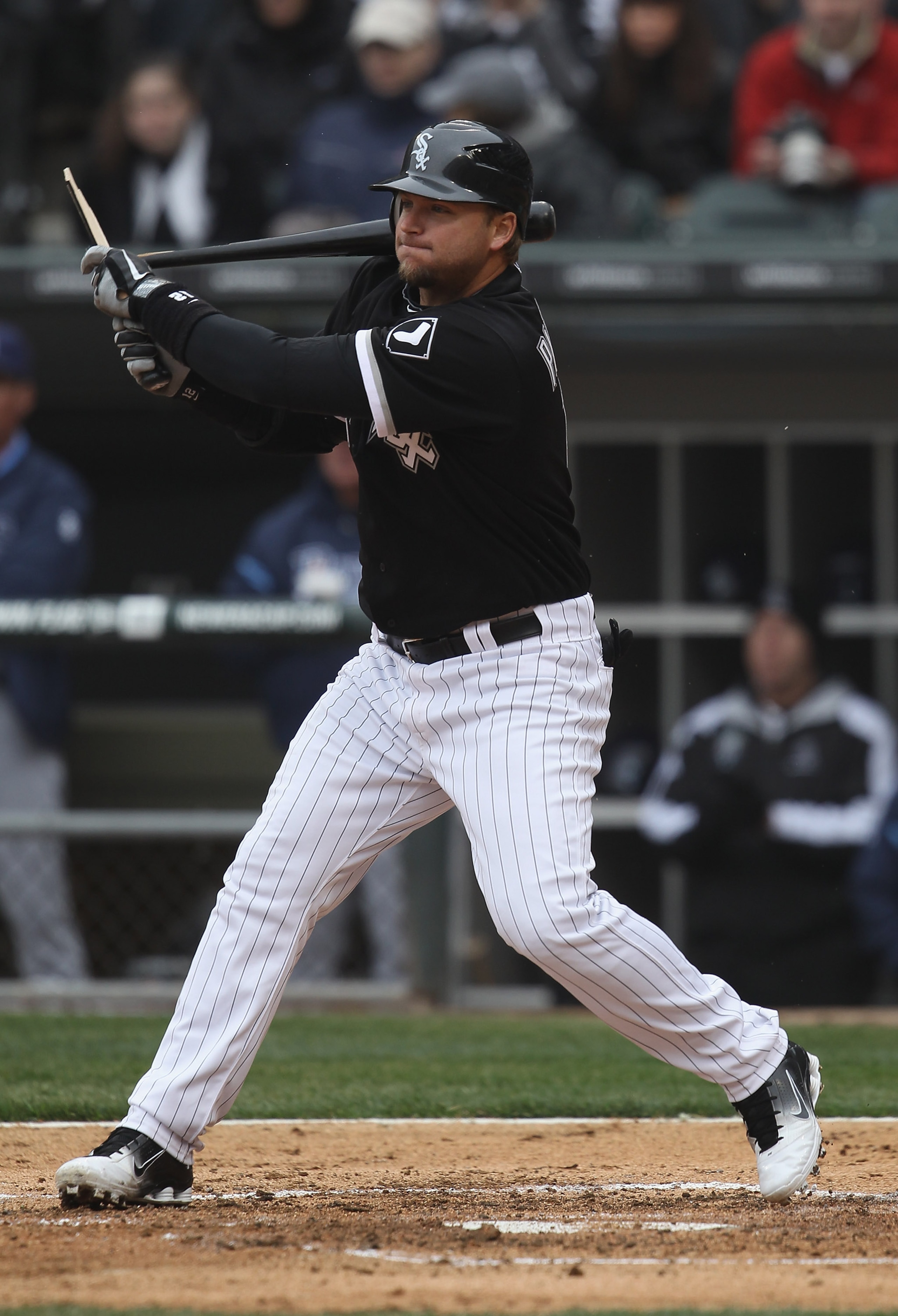 CHICAGO, IL - APRIL 07: A.J. Pierzynski #12 of the Chicago White Sox breaks his bat hitting the ball against the Tampa Bay Rays during the home opener at U.S. Cellular Field on April 7, 2011 in Chicago, Illinois. The White Sox defeated the Rays 5-1.  (Pho