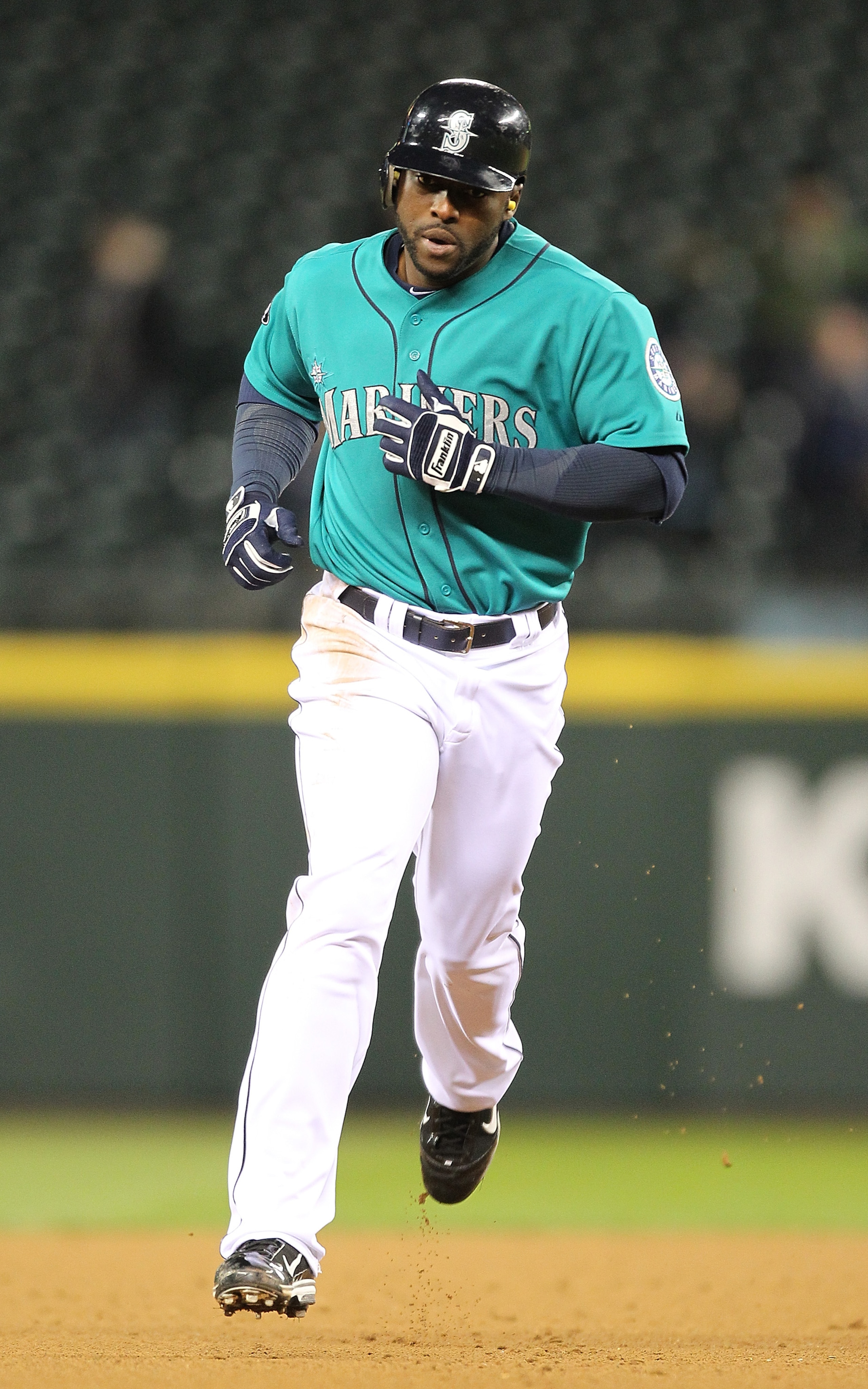 SEATTLE - APRIL 11:  Milton Bradley #15 of the Seattle Mariners rounds the bases after homering against the Toronto Blue Jays at Safeco Field on April 11, 2011 in Seattle, Washington. (Photo by Otto Greule Jr/Getty Images)