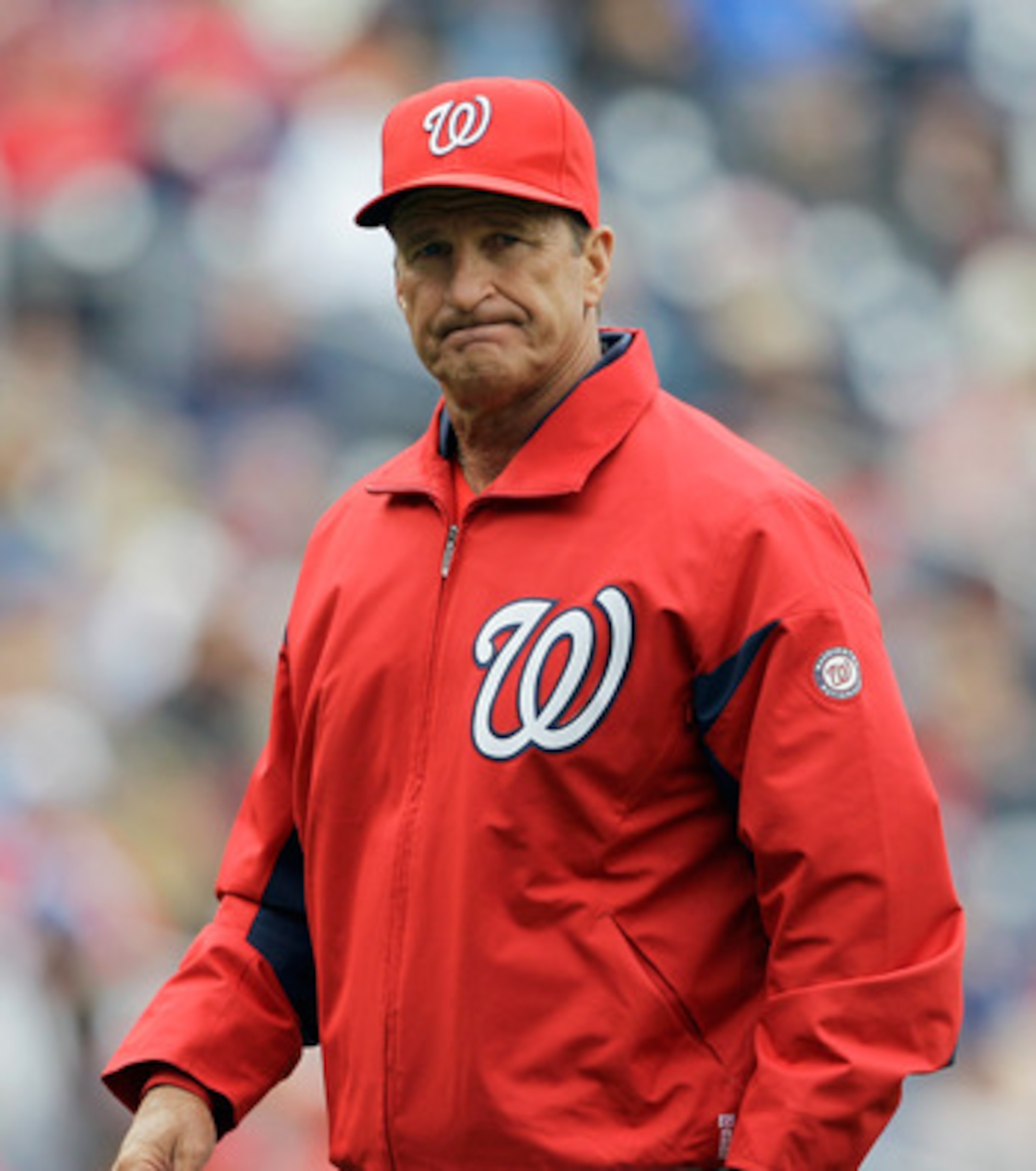 WASHINGTON, DC - APRIL 03: Jim Riggleman #5 manager of the Washington Nationals walks off the field after a pitching change against the Atlanta Braves during the seventh inning at Nationals Park on April 3, 2011 in Washington, DC.  (Photo by Rob Carr/Gett