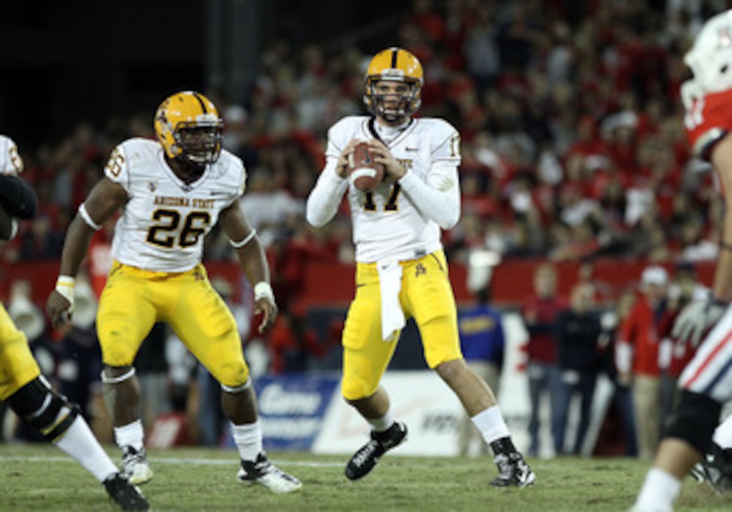 TUCSON, AZ - DECEMBER 02:  Quarterback Brock Osweiler #17 of the Arizona State Sun Devils scrambles with the football during the college football game at Arizona Stadium on December 2, 2010 in Tucson, Arizona. The Sun Devils defeated the Wildcats 30-29 in