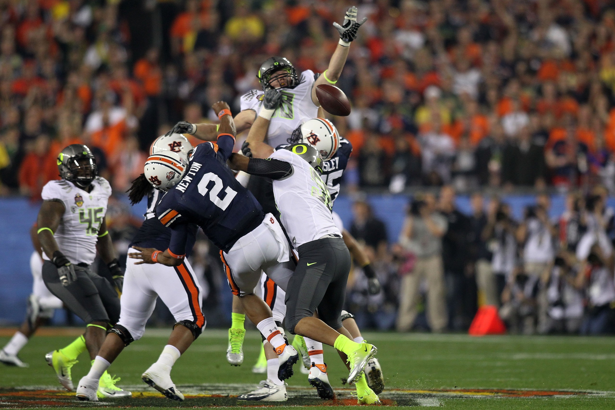 GLENDALE, AZ - JANUARY 10: Cameron Newton #2 of the Auburn Tigers has a pass blocked by the Oregon Ducks during the Tostitos BCS National Championship Game at University of Phoenix Stadium on January 10, 2011 in Glendale, Arizona. (Photo by Jonathan Fer GLENDALE, AZ - JANUARY 10: Cameron Newton #2 of the Auburn Tigers has a pass blocked by the Oregon Ducks during the Tostitos BCS National Championship Game at University of Phoenix Stadium on January 10, 2011 in Glendale, Arizona. (Photo by Jonathan Fer