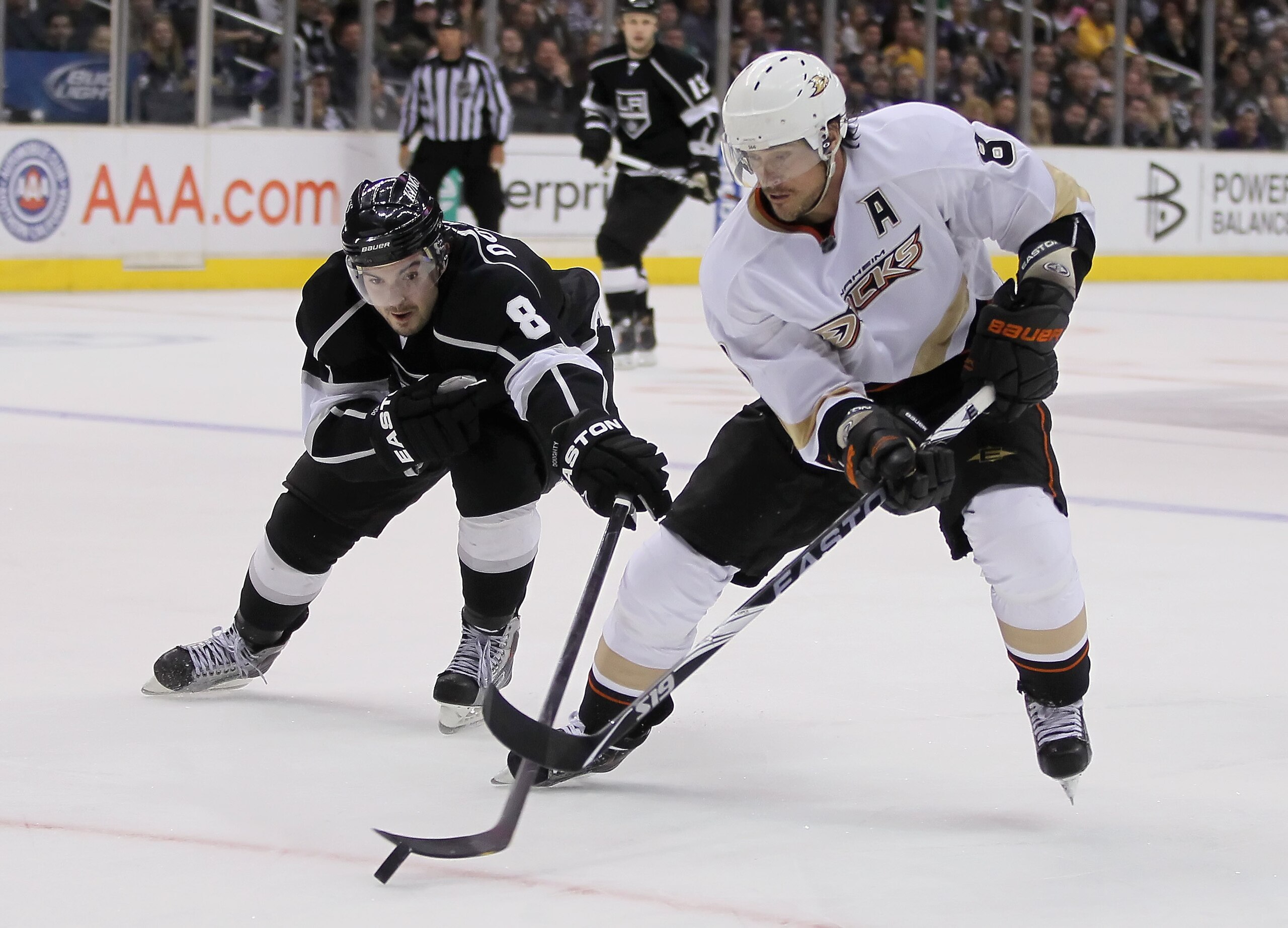 LOS ANGELES, CA - APRIL 09:  Teemu Selanne #8 of the Anaheim Ducks is pursued by Drew Doughty #8 of the Los Angeles Kings for the puck in the third period at Staples Center on April 9, 2011 in Los Angeles, California. The Ducks defeated the Kings 3-1. (Ph