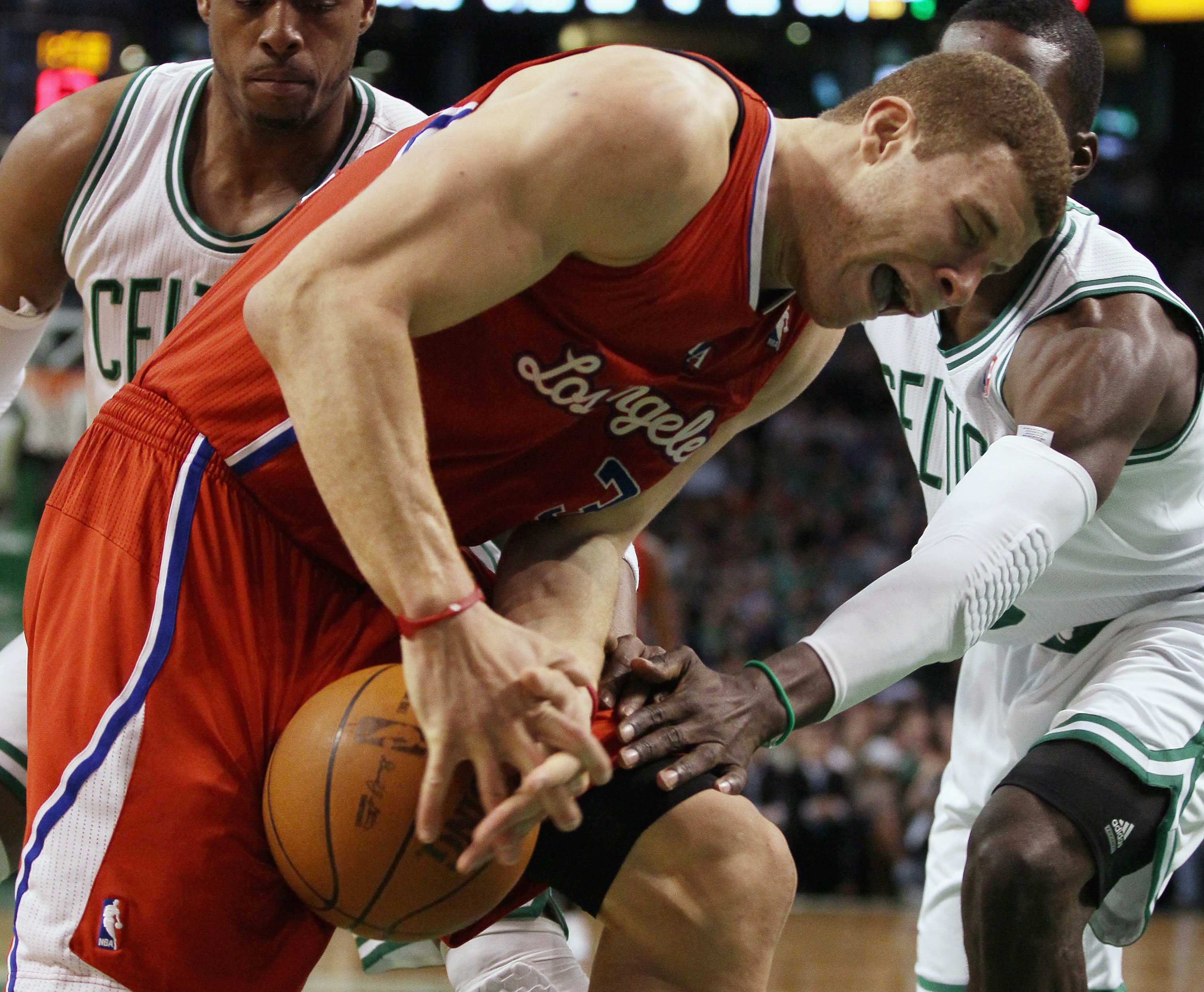 BOSTON, MA - MARCH 09:  Blake Griffin #32 of the Los Angeles Clippers tries to hang on to the ball as Rajon Rondo #9 of the Boston Celtics defends on March 9, 2011 at the TD Garden in Boston, Massachusetts. The Los Angeles Clippers defeated the Boston Cel