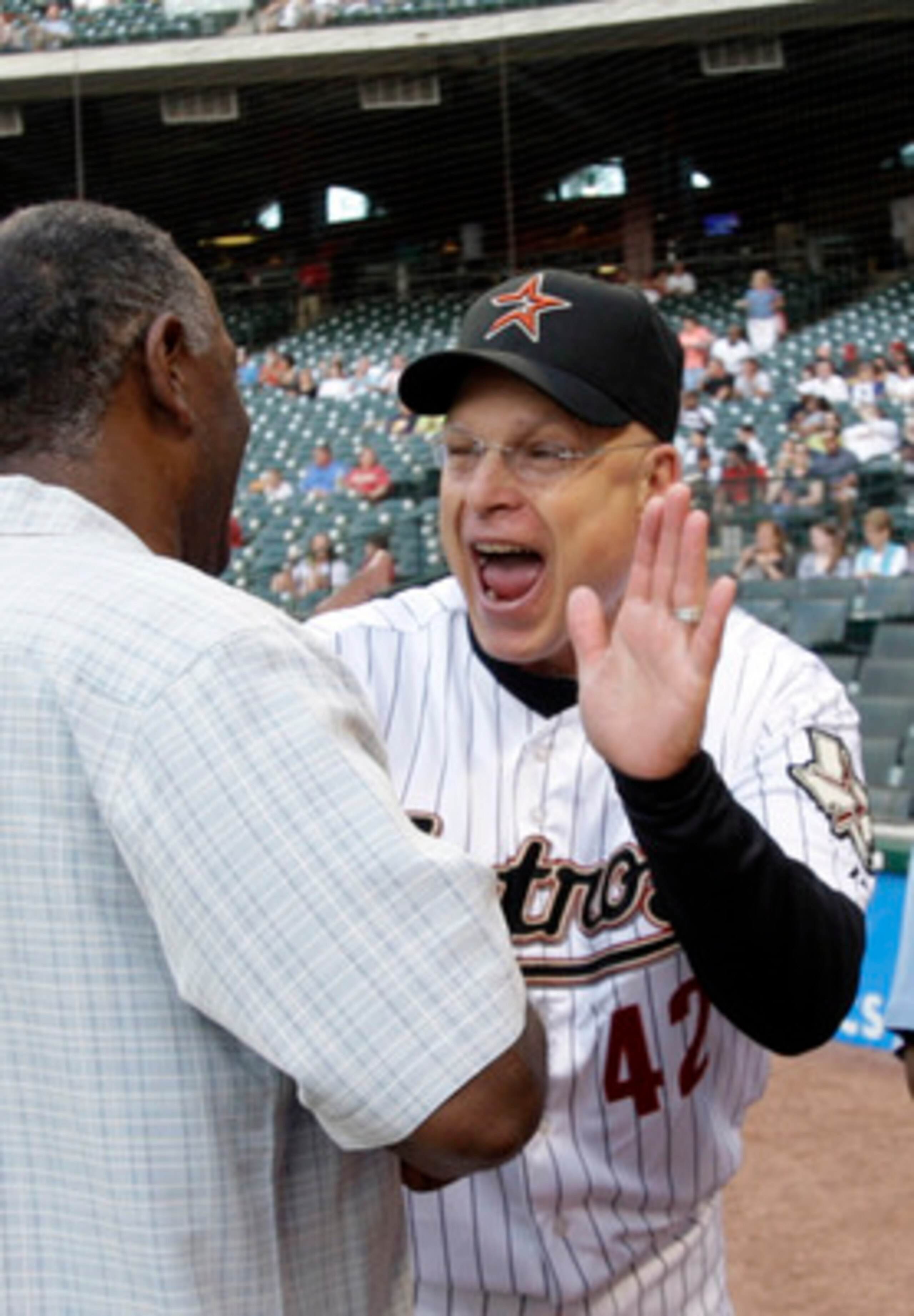 HOUSTON - APRIL 15:  Brad Mills (R) manager of the Houston Astros chats with former Astros Enos Cabell (L) and Kevin Bass before a game against the San Diego Padres at Minute Maid Park on April 15, 2011 in Houston, Texas.  (Photo by Bob Levey/Getty Images