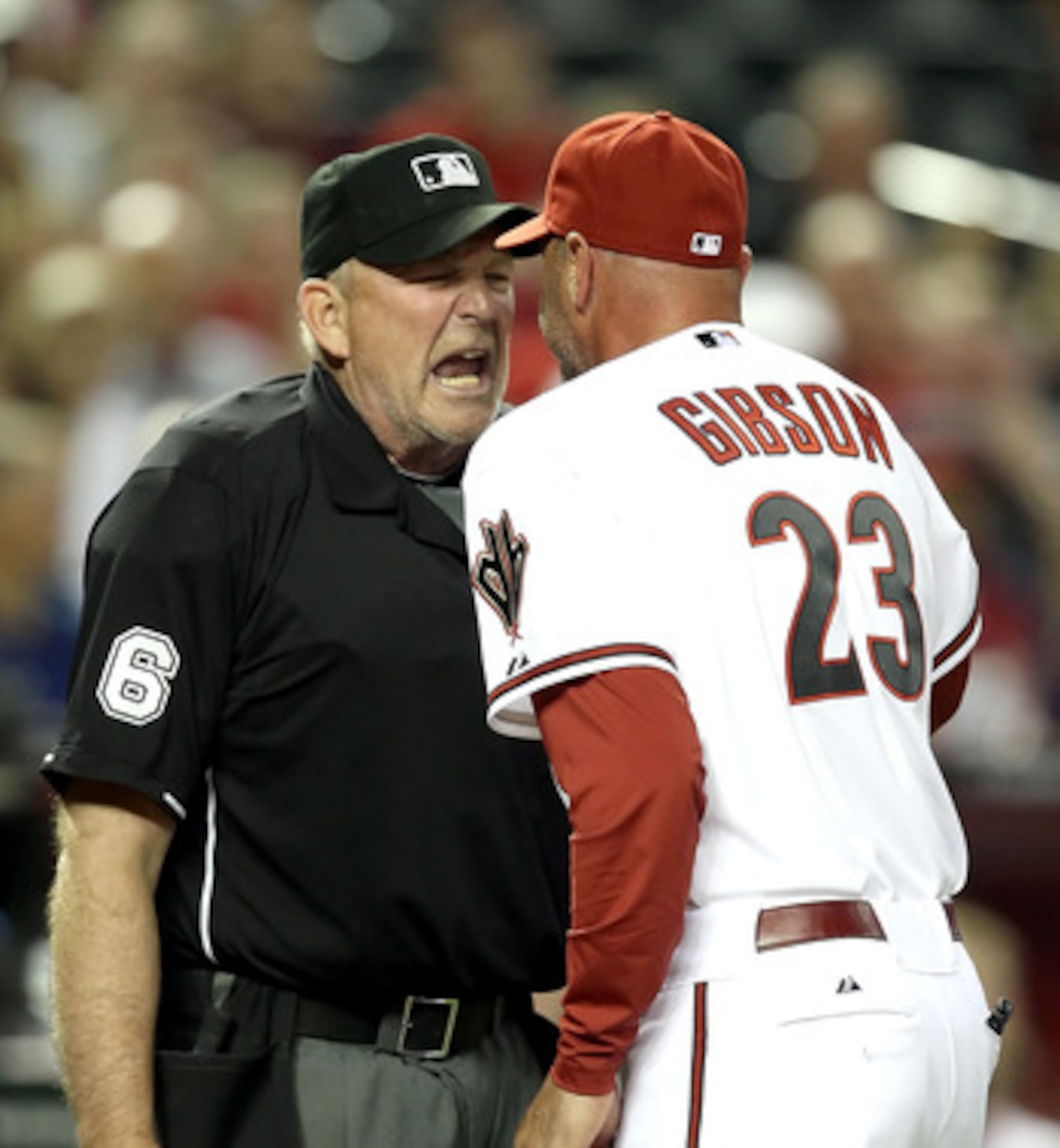 PHOENIX, AZ - APRIL 12:  Manager Kirk Gibson of the Arizona Diamondbacks argues with home plate home plate umpire Bob Davidson after being ejected from the Major League Baseball game against the St. Louis Cardinals at Chase Field on April 12, 2011 in Phoe