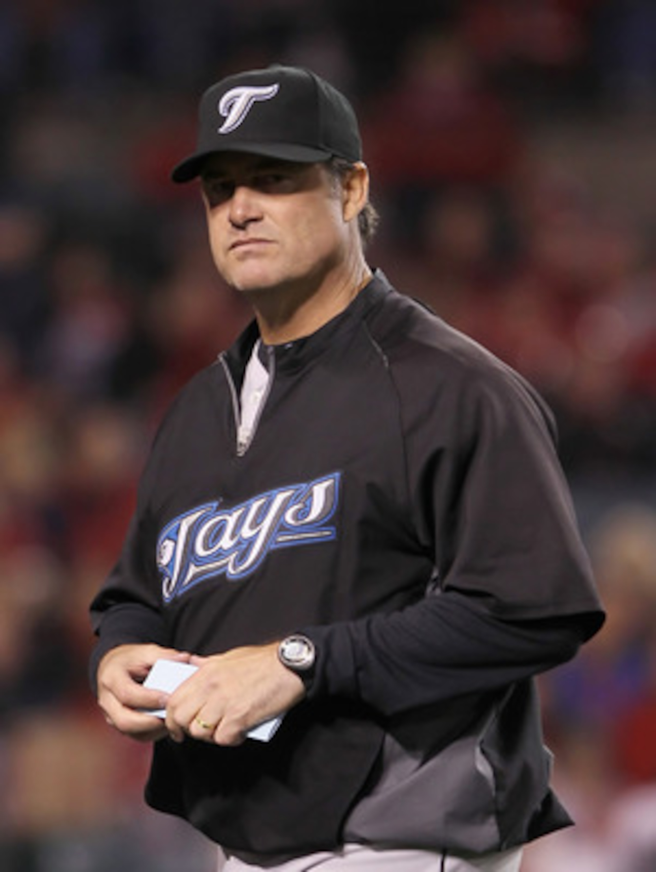ANAHEIM, CA - APRIL 08:  Toronto Blue Jays manager John Farrell walks back to the dugout in the eighth inning against the Los Angeles Angels of Anaheim at Angel Stadium of Anaheim on April 8, 2011 in Anaheim, California. The Blue Jays defeated the Angels