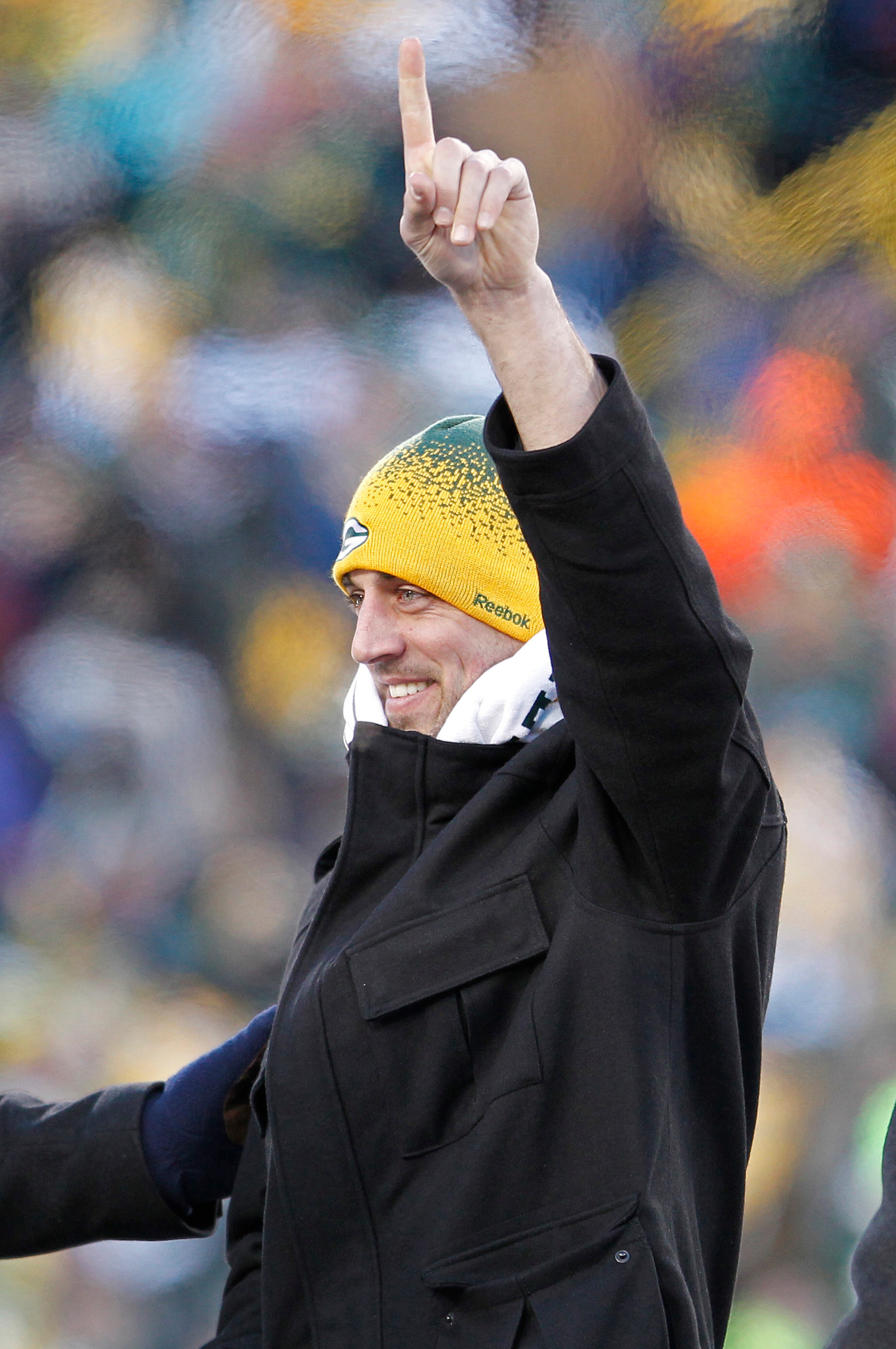 GREEN BAY, WI - FEBRUARY 08:  Green Bay Packers quarterback Aaron Rodgers address fans during the Packers victory ceremony at Lambeau Field on February 8, 2011 in Green Bay, Wisconsin.  (Photo by Matt Ludtke/Getty Images)