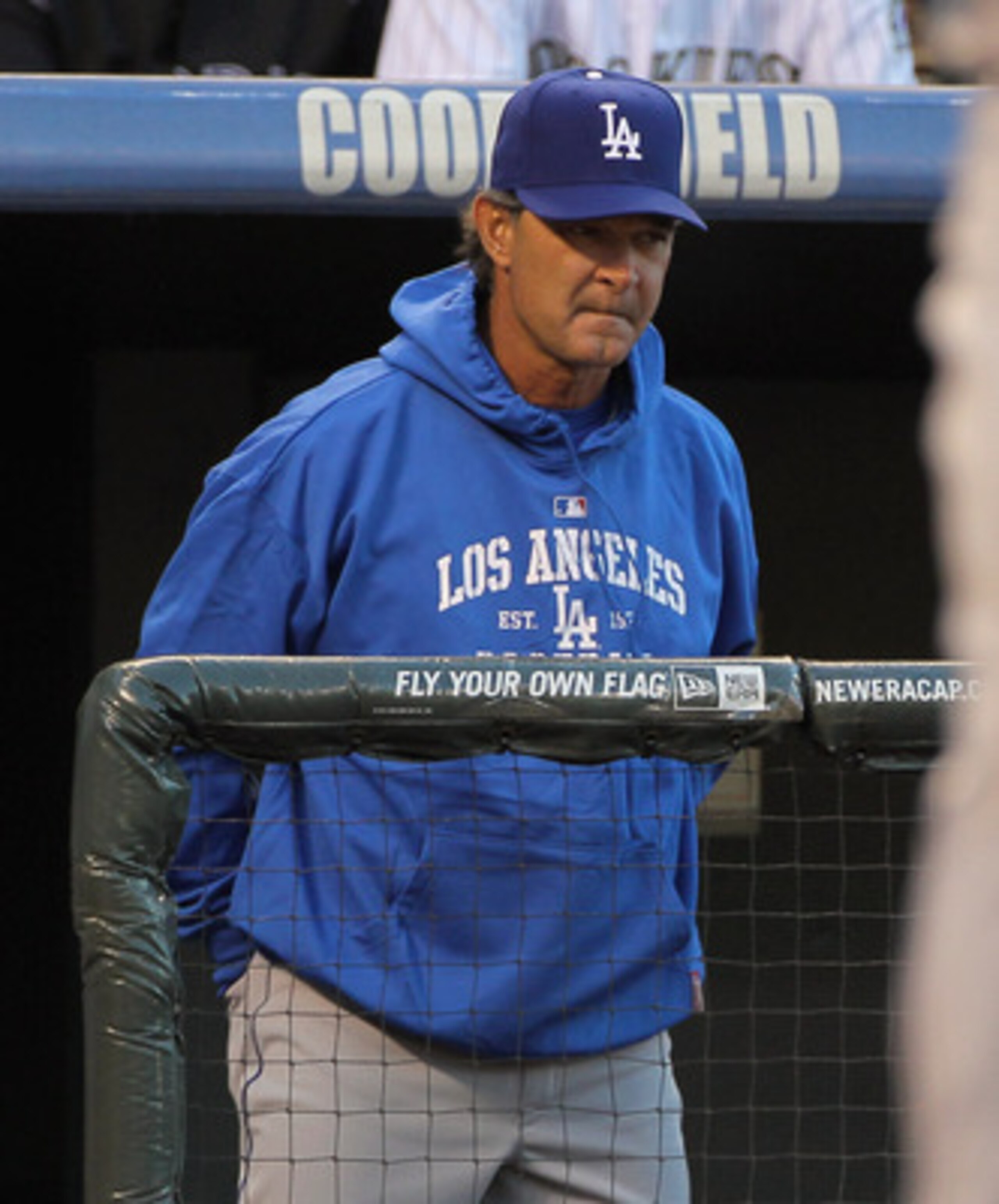 DENVER, CO - APRIL 05:  Manager Don Mattingly  of the Los Angeles Dodgers oversees the action as his team faces the Colorado Rockies at Coors Field on April 5, 2011 in Denver, Colorado. The Rockies defeated the Dodgers 3-0.  (Photo by Doug Pensinger/Getty