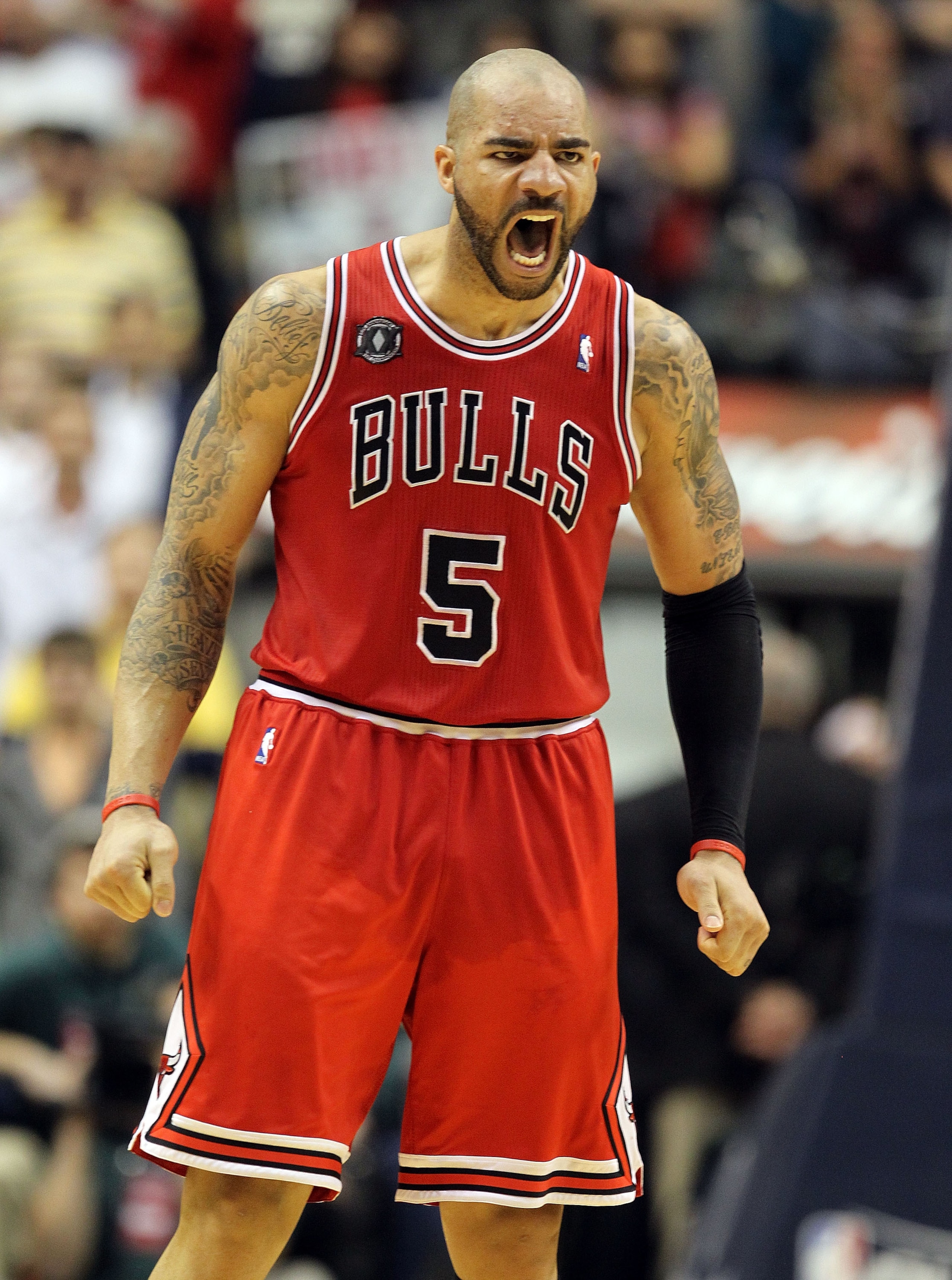 INDIANAPOLIS, IN - APRIL 21: Carlos Boozer #5 of the Chicago Bulls celebrates after Derrick Rose hit the game winning shot against the Indiana Pacers in Game three of the Eastern Conference Quarterfinals in the 2011 NBA Playoffs on April 21, 2011 at Con INDIANAPOLIS, IN - APRIL 21: Carlos Boozer #5 of the Chicago Bulls celebrates after Derrick Rose hit the game winning shot against the Indiana Pacers in Game three of the Eastern Conference Quarterfinals in the 2011 NBA Playoffs on April 21, 2011 at Con