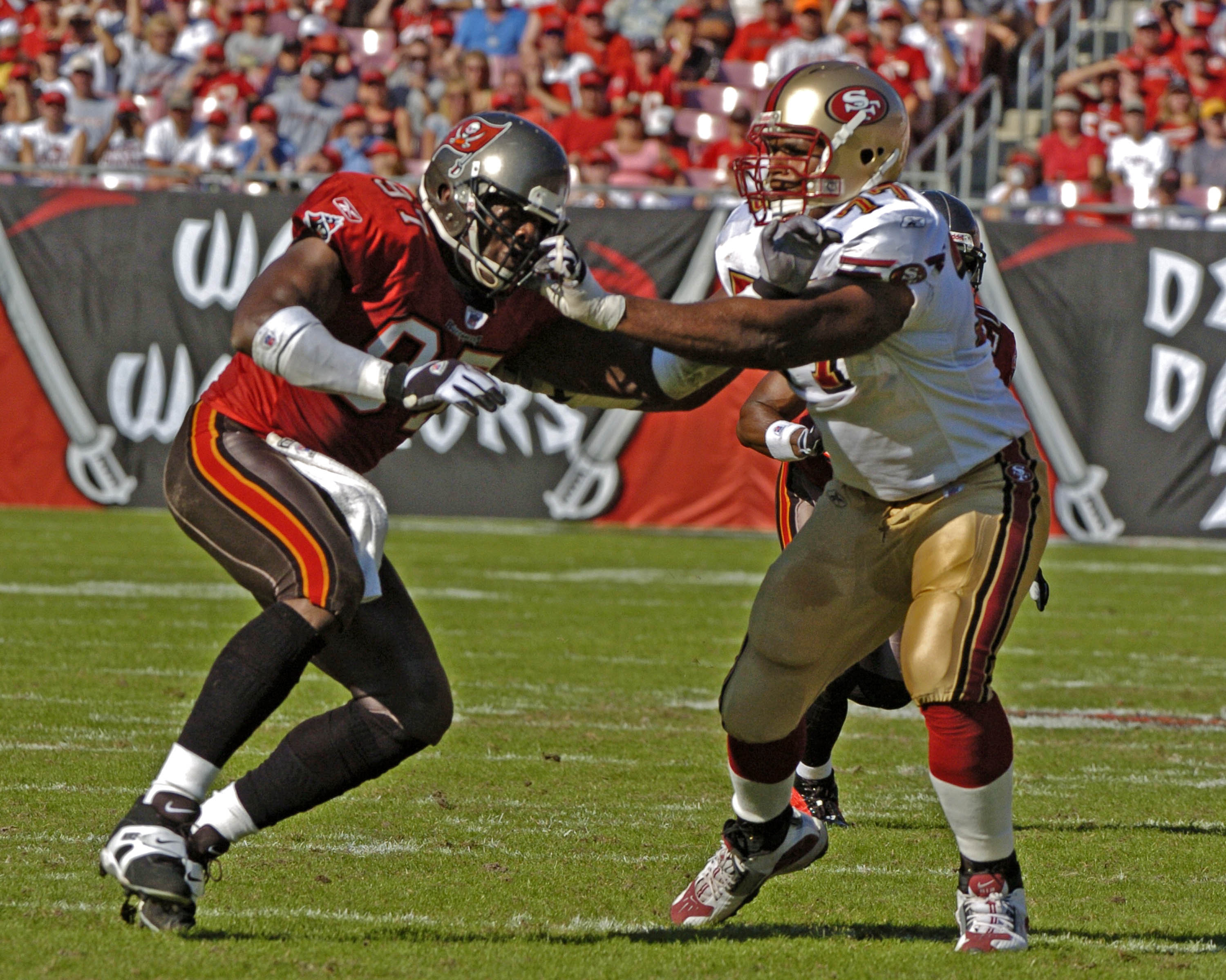 Tampa Bay Buccaneers defensive end Simeon Rice battles San francisco 49ers tackle Kwame Harris at Raymond James Stadium in Tampa, Florida November 21, 2004. The Buccaneers defeated the San Francisco 49ers 35 to 3. (Photo by Al Messerschmidt/Getty Ima Tampa Bay Buccaneers defensive end Simeon Rice battles San francisco 49ers tackle Kwame Harris at Raymond James Stadium in Tampa, Florida November 21, 2004. The Buccaneers defeated the San Francisco 49ers 35 to 3. (Photo by Al Messerschmidt/Getty Ima