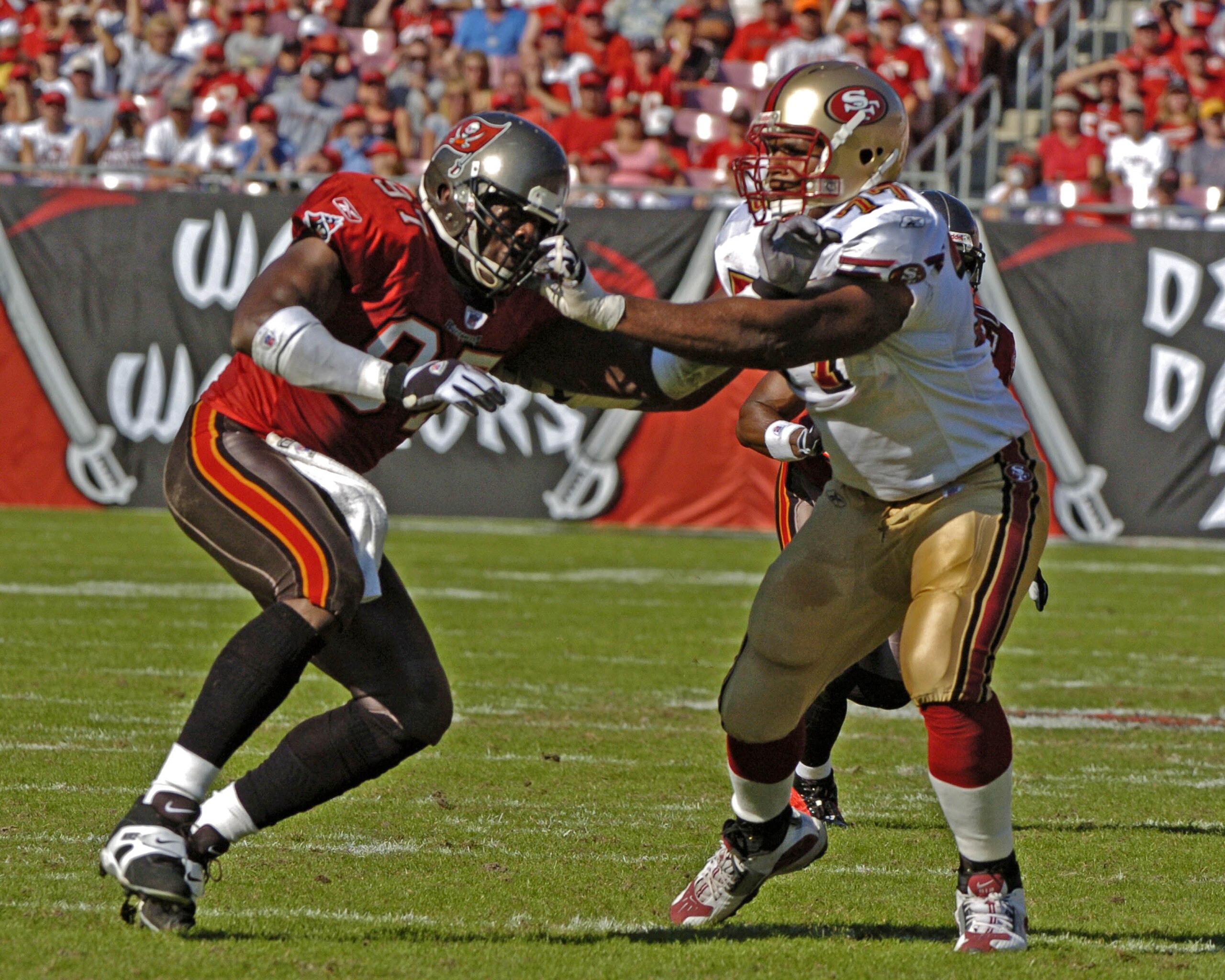 Tampa Bay Buccaneers defensive end Simeon Rice battles San francisco 49ers tackle Kwame Harris  at Raymond James Stadium in Tampa, Florida November 21, 2004.  The  Buccaneers defeated the  San Francisco 49ers 35 to 3.  (Photo by Al Messerschmidt/Getty Ima
