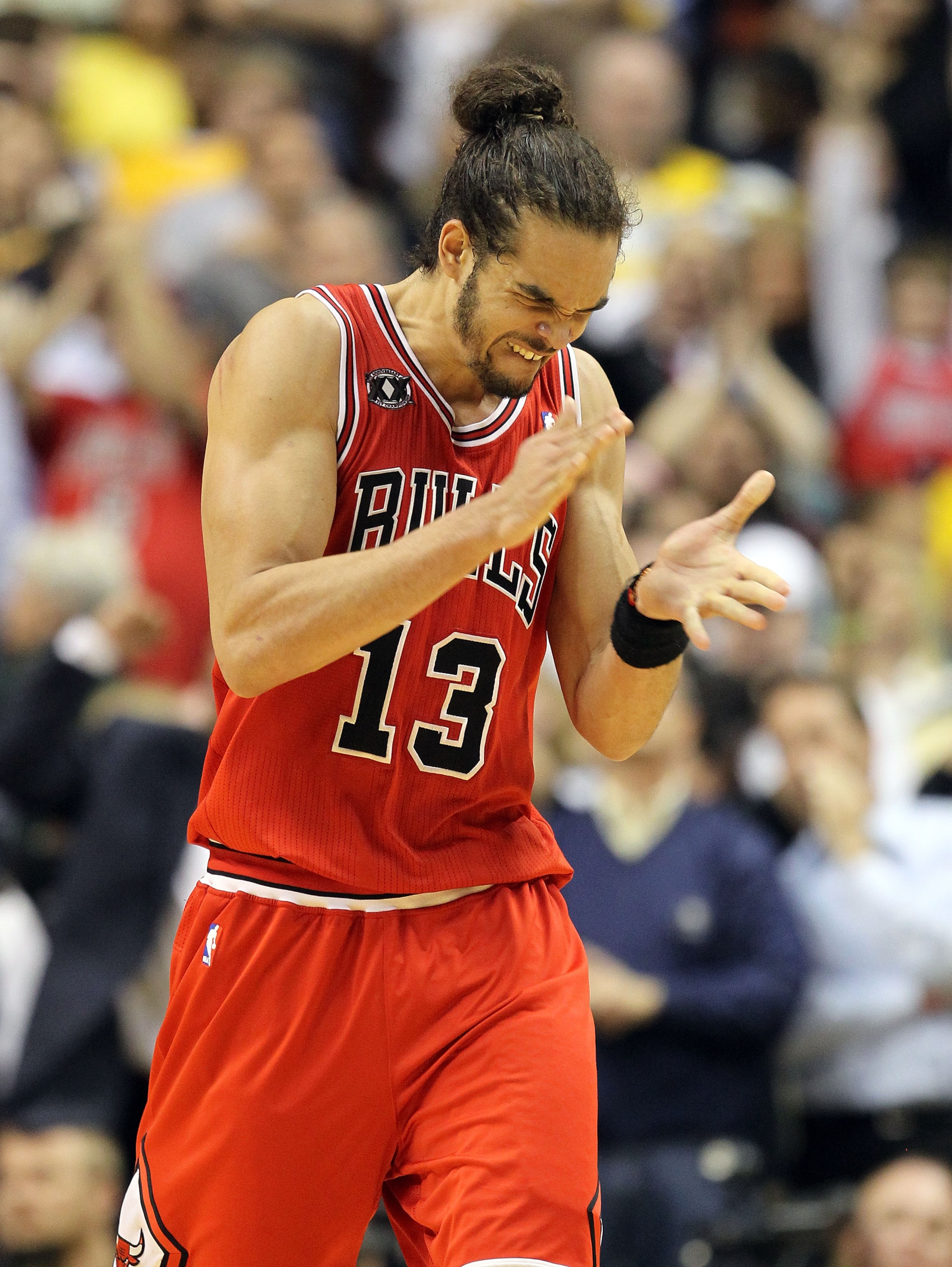 INDIANAPOLIS, IN - APRIL 21:  Joakim Noah #13 of the Chicago Bulls celebrates after Derrick Rose hit the game winning shot against the Indiana Pacers in Game three of the Eastern Conference Quarterfinals in the 2011 NBA Playoffs on April 21, 2011  at Cons