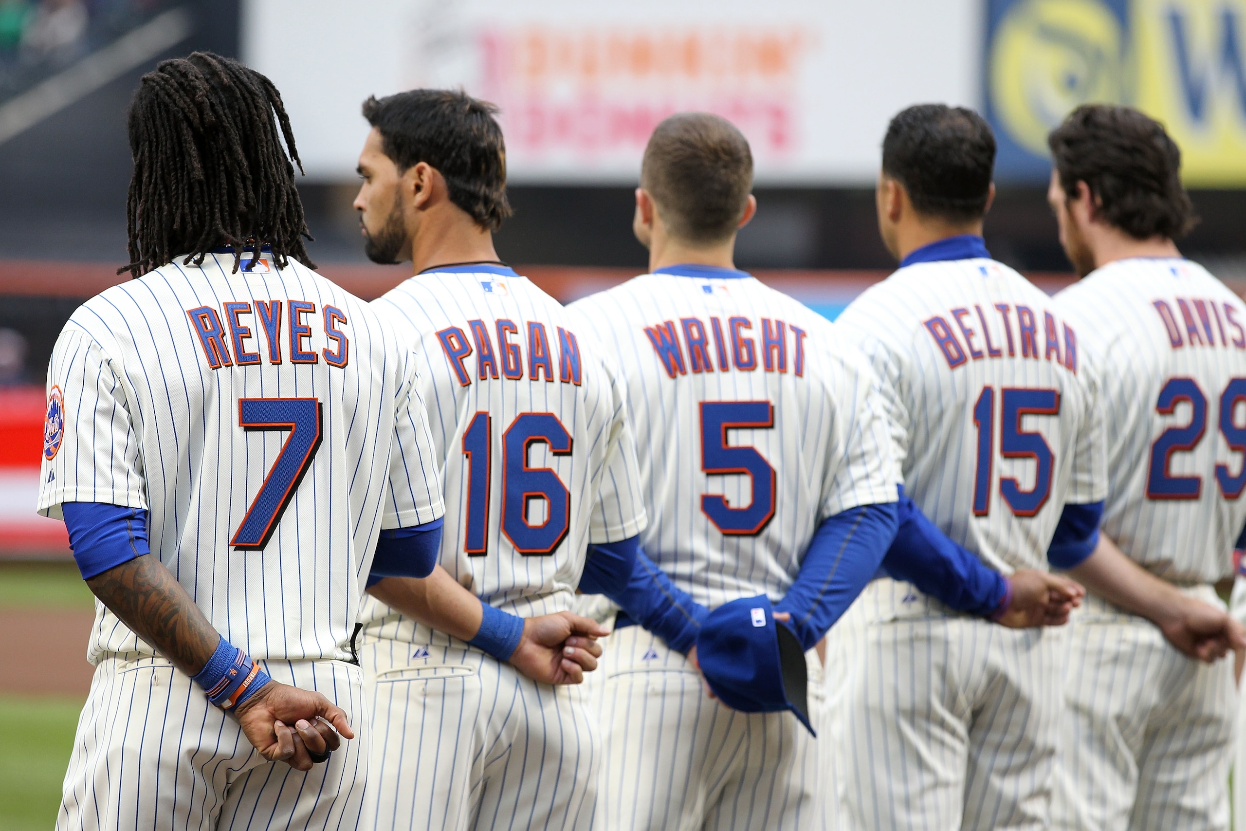 NEW YORK, NY - APRIL 08:  (L-R) Jose Reyes #7, Angel Pagan #16, David Wright #5, Carlos Beltran #15 and Ike Davis #29 of the New York Mets line up during pregame festivities against the Washington Nationals during the Mets' Home Opener at Citi Field on Ap