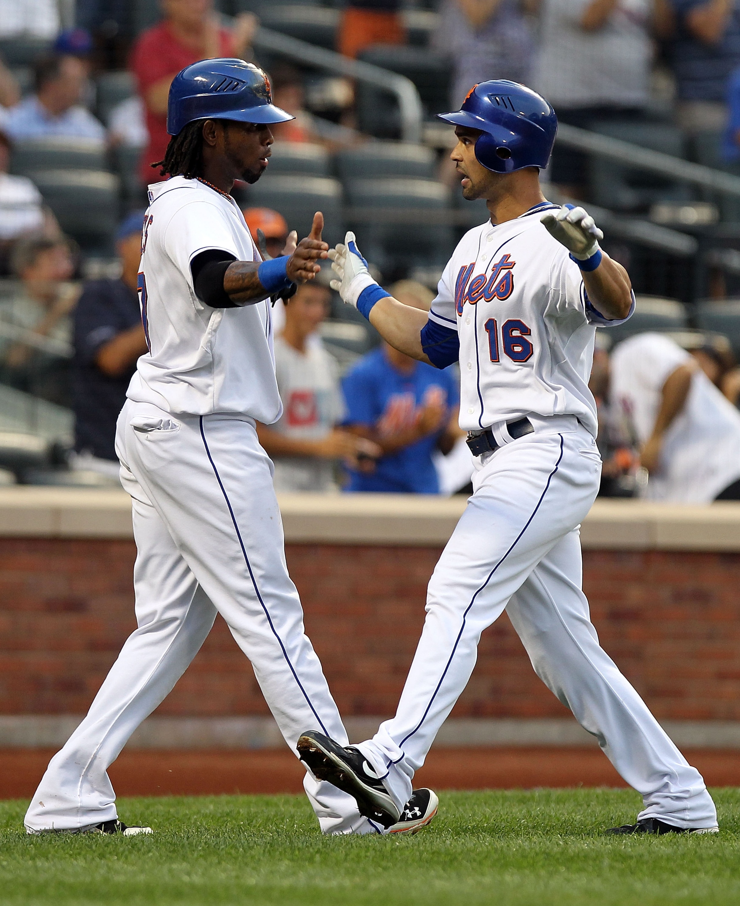 NEW YORK - AUGUST 11:  Angel Pagan #16 of the New York Mets is congratulated by scoring teammate Jose Reyes after a two run home run in the first inning against the Colorado Rockies at Citi Field on August 11, 2010 in the Flushing neighborhood of the Quee