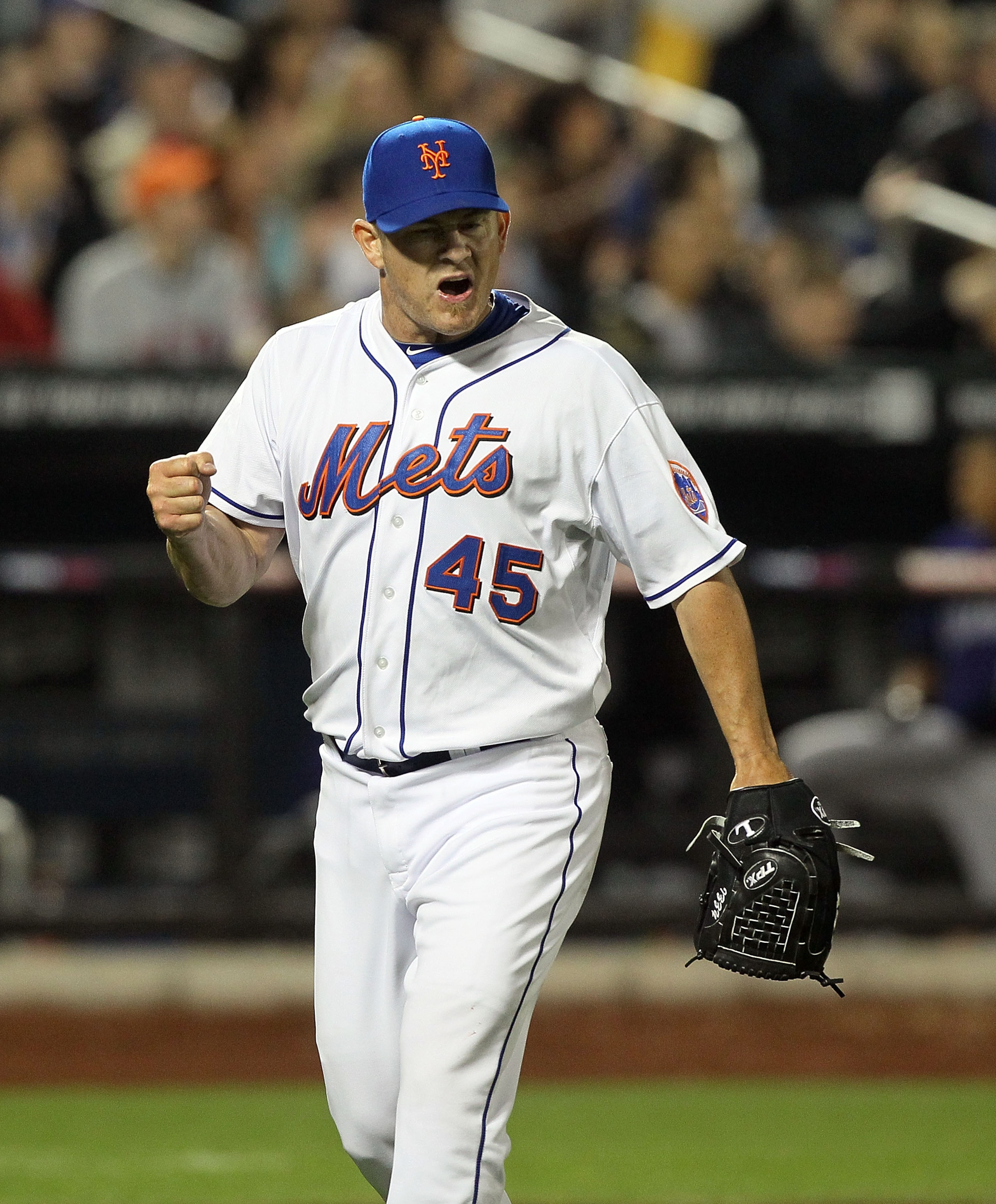 NEW YORK, NY - APRIL 11:  Jason Isringhausen #45 of the New York Mets celebrates getting the final out of the seventh inning against the Colorado Rockies on April 11, 2011 at Citi Field in the Flushing neighborhood of the Queens borough of New York City.