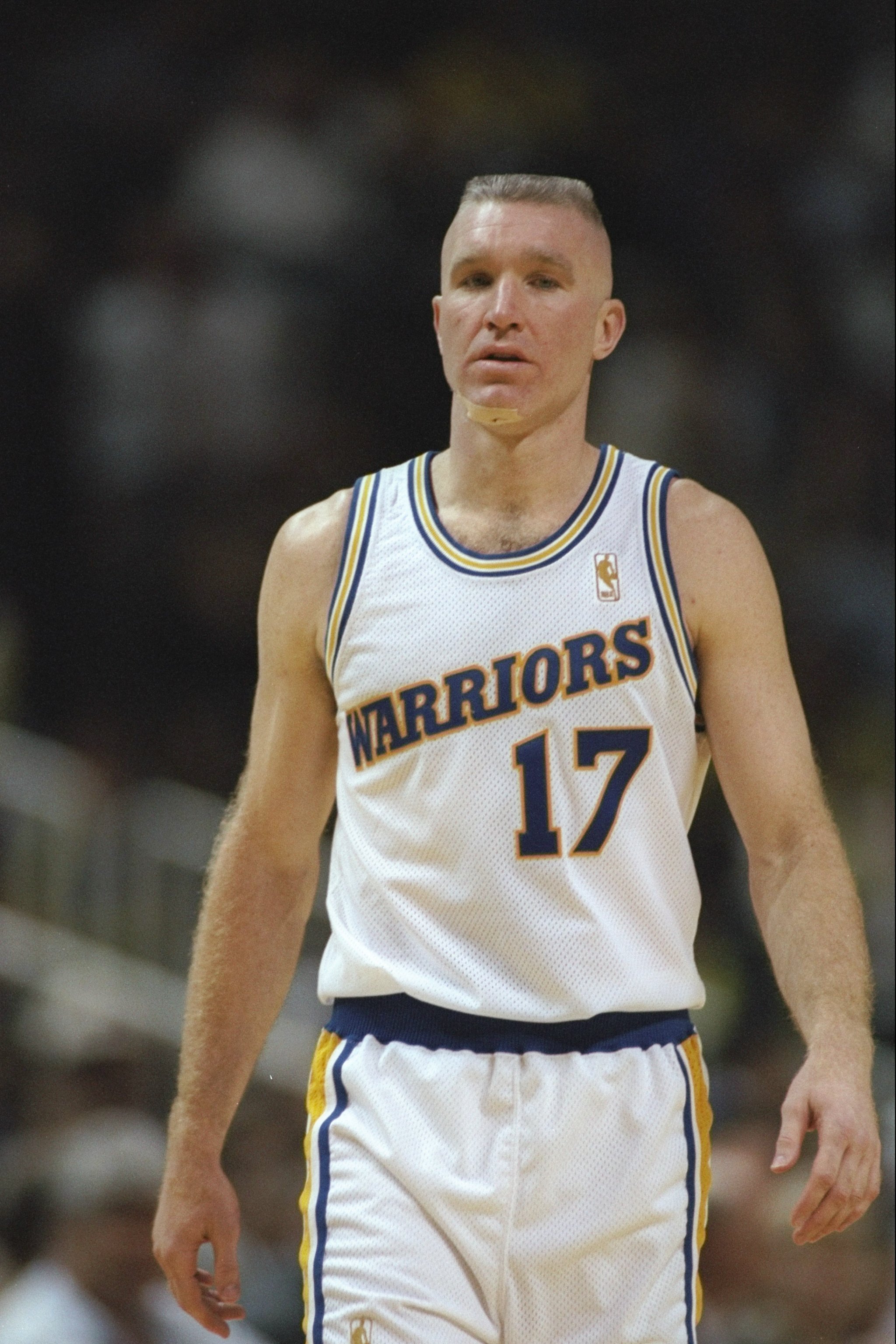 Forward Chris Mullin of the Golden State Warriors stands on the court during a game against the Los Angeles Clippers at the San Jose Arena in San Jose, California. The Clippers won the game 97-85.