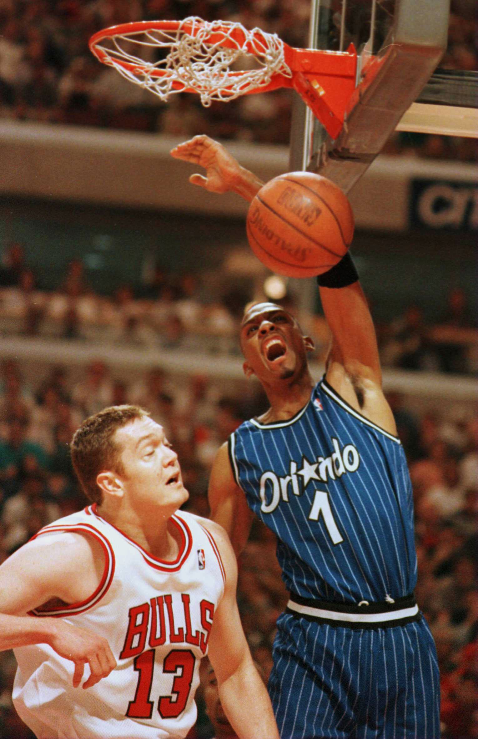 19 May 1996: Forward Anfernee ''Penny'' Hardaway #1 of the Orlando Magic dunks the ball over Center Luc Longley #13 of the Chicago Bulls during first quarter action of game one of the Eastern Conference Championships at the United Center in Chicago, Illin