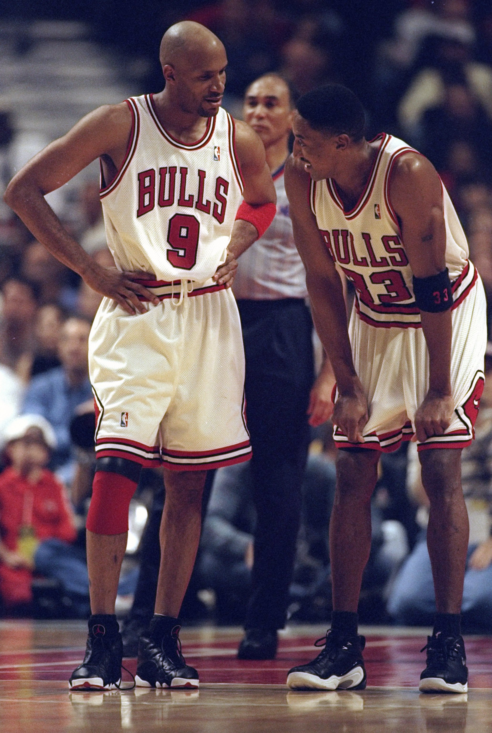 3 May 1998: Ron Harper #9 talks with Scottie Pippen #33 of the Chicago Bulls during the NBA Playoffs round 1 game against the Charlotte Hornets at the United Center in Chicago, Illinois. The Bulls defeated the Hornets 83-70.