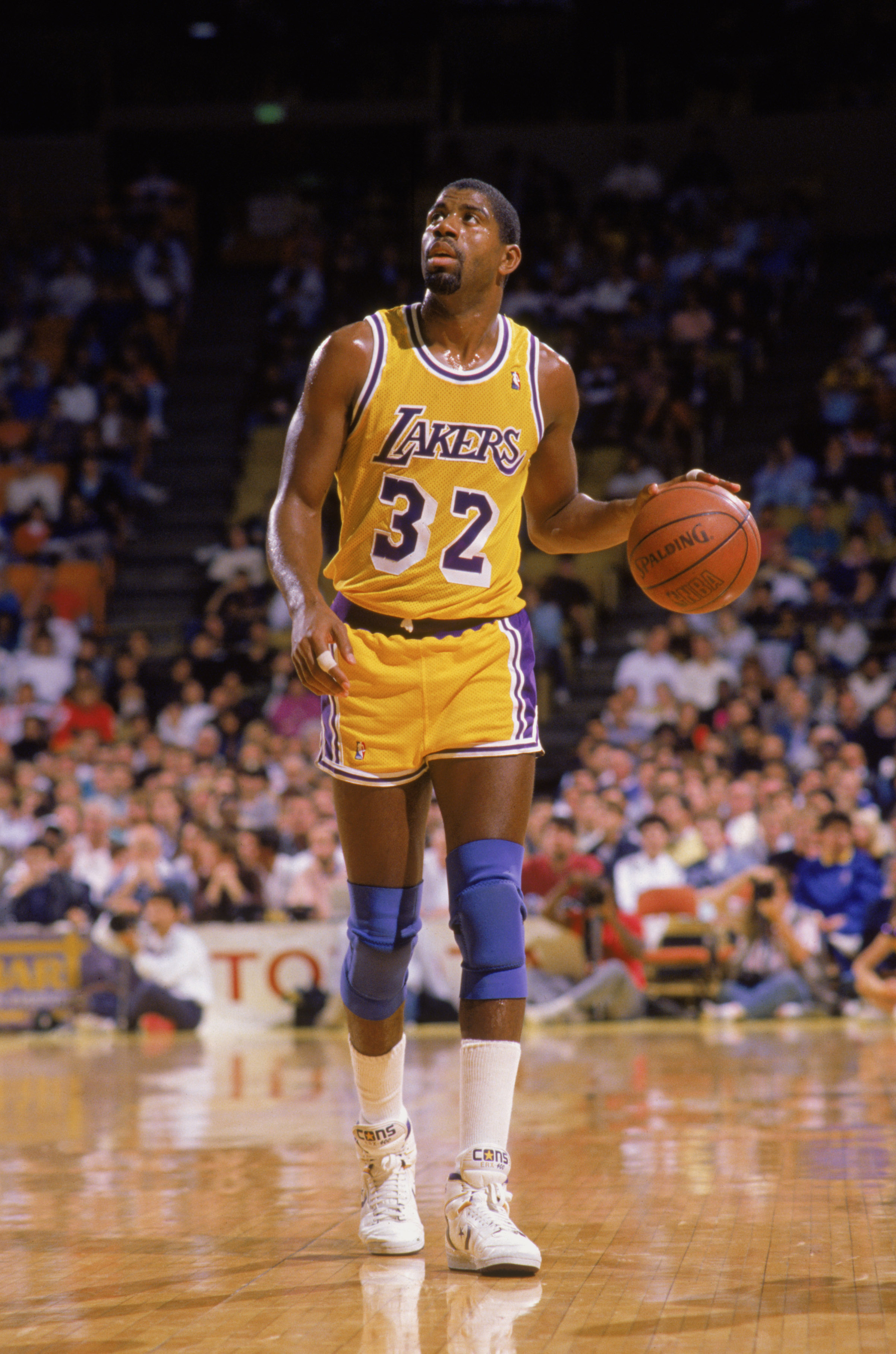 LOS ANGELES - 1988:  Magic Johnson #32 of the Los Angeles Lakers dribbles the ball during an NBA game at the Great Western Forum in Los Angeles, California in 1988. (Photo by: Mike Powell/Getty Images)