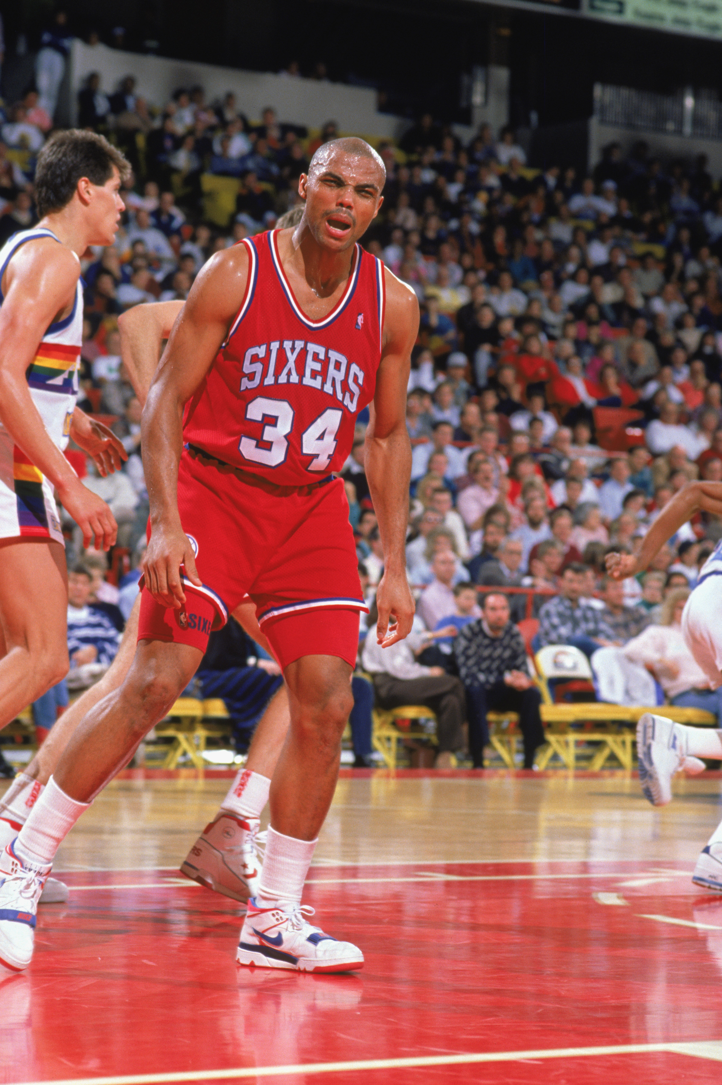DENVER - 1989:  Charles Barkley #34 of the Philadelphia 76ers reacts to the 1989-1990 NBA season game at the McNichols Arena in Denver, Colorado. (Photo by Tim Defrisco/Getty Images)