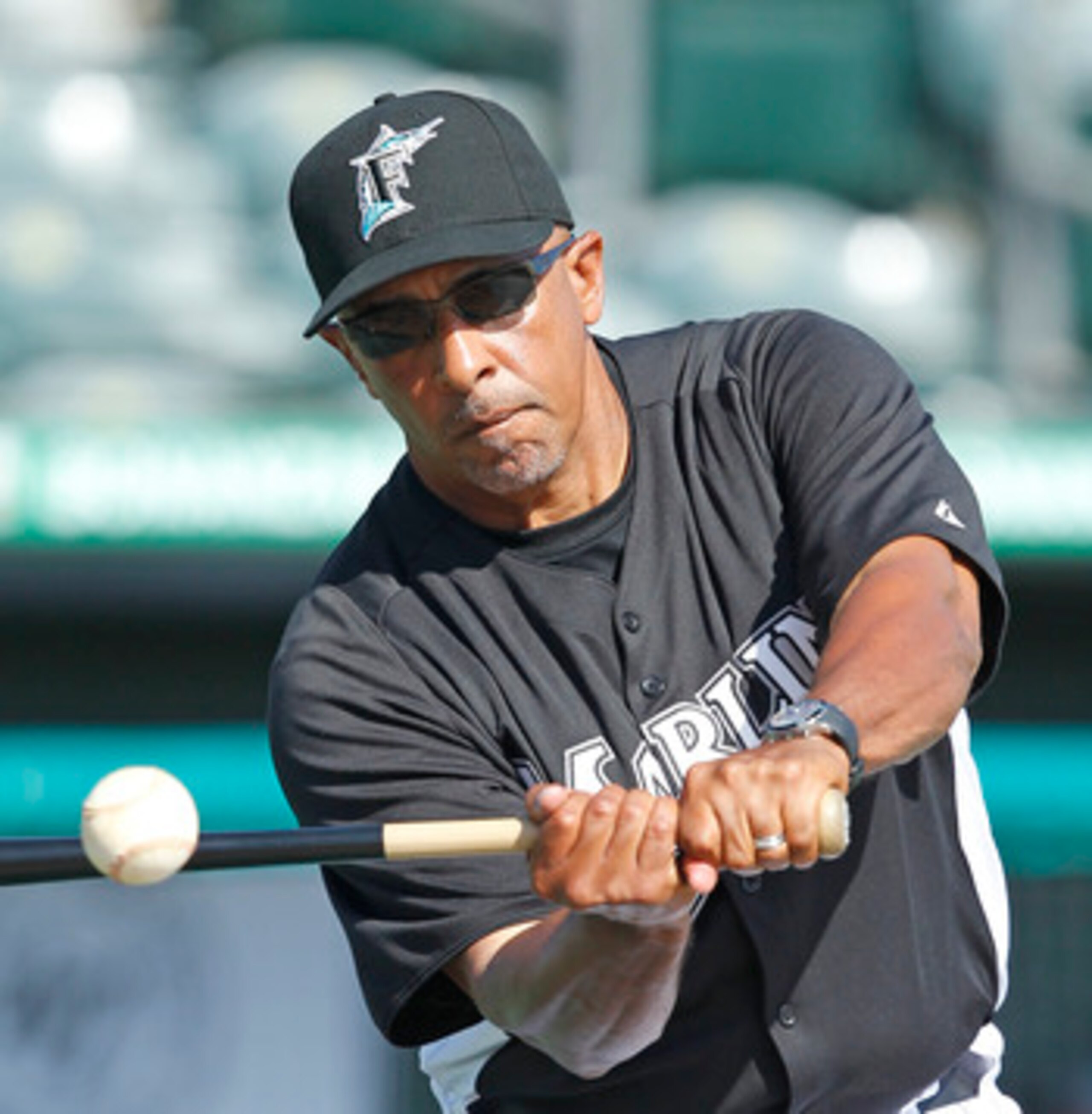 JUPITER, FL - MARCH 24: Manager Edwin Rodriguez #36 of the Florida Marlins hits the ball during fielding practice prior to the game against the Boston Red Sox at Roger Dean Stadium on March 24, 2011 in Jupiter, Florida. (Photo by Joel Auerbach/Getty Image