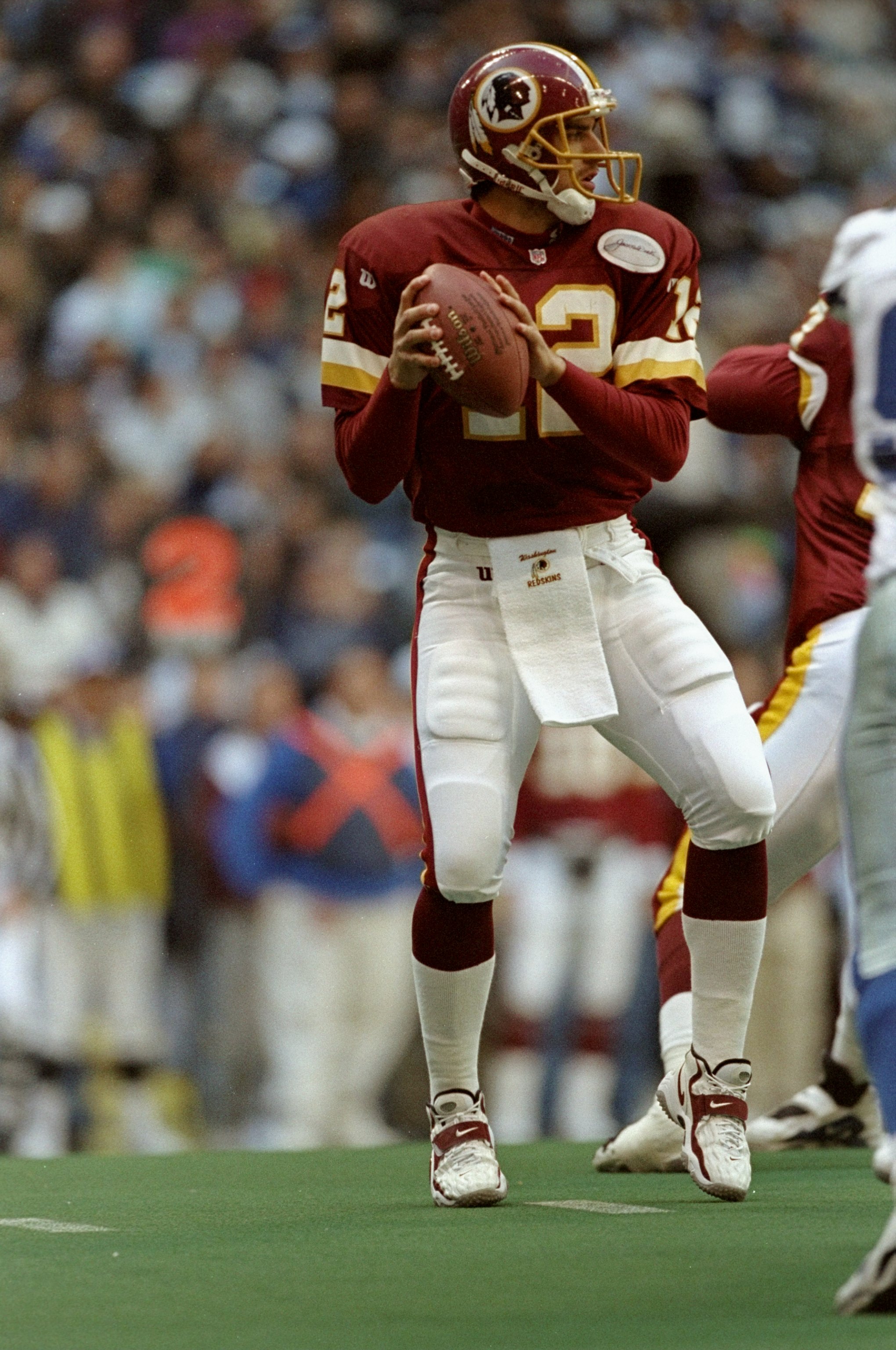 December 31, 1972 - Washington, District of Columbia, United States of  America - Dallas Cowboys quarterback Roger Staubach (12) is hit just as he  releases the ball by Washington Redskins right defensive