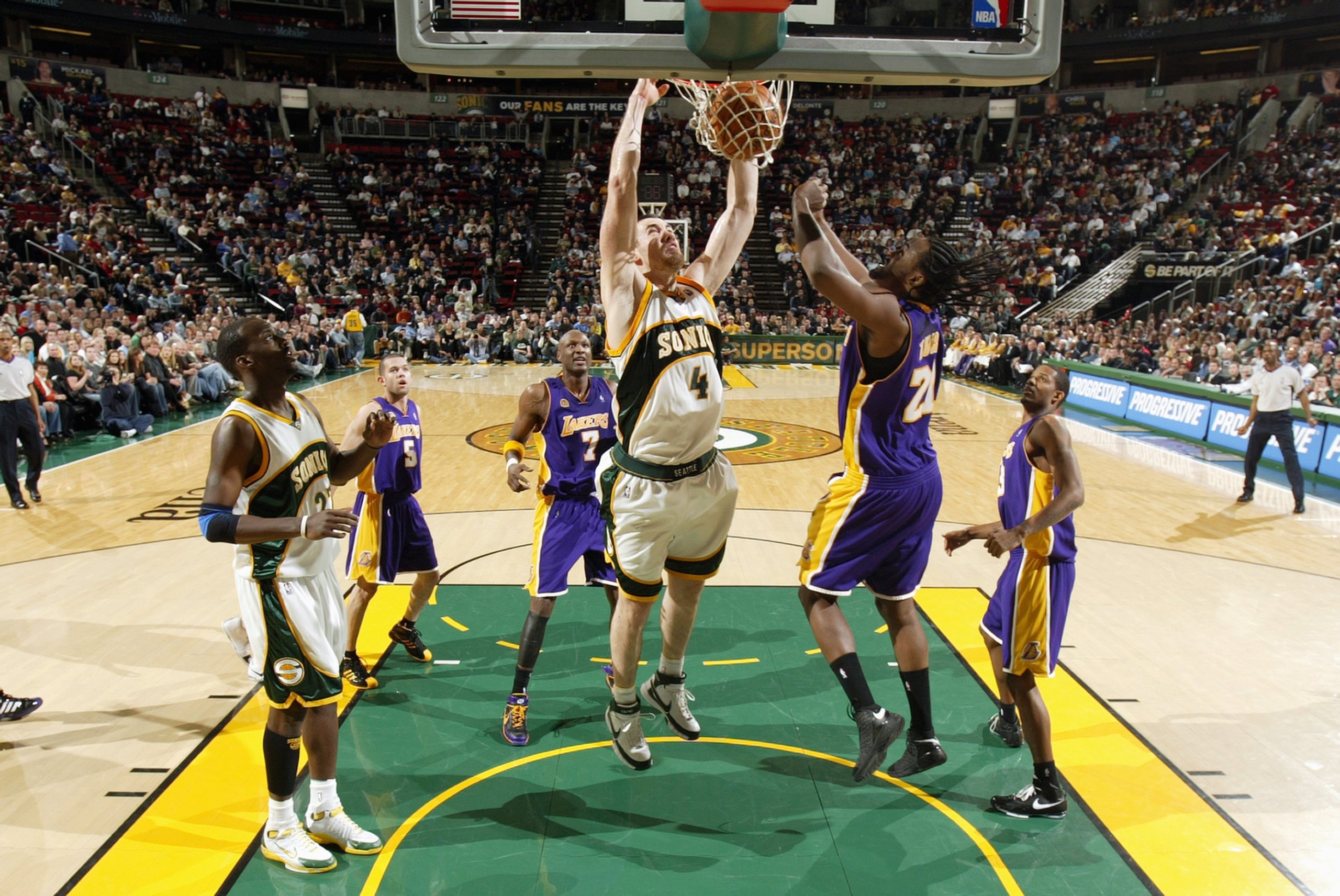 SEATTLE - JANUARY 14:  Nick Collison #4 of the Seattle SuperSonics dunks the ball against Ronny Turiaf #21 of the Los Angeles Lakers during the game at Key Arena on January 14, 2008 in Seattle, Washington.  The Lakers won 123-121.  NOTE TO USER: User expr