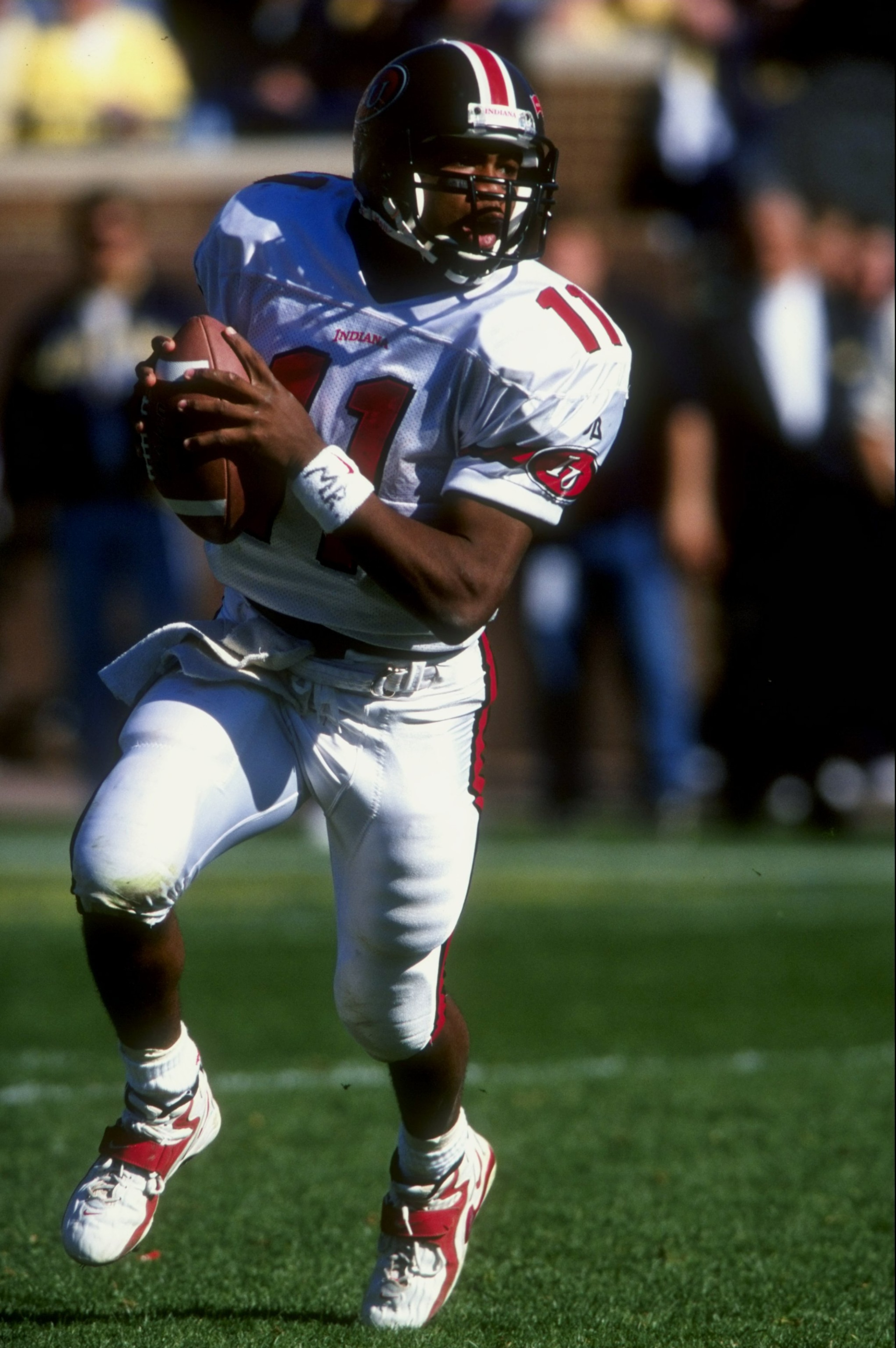 24 Oct 1998: Quarterback Antwan Randle El #11 of the Indiana Hoosiers looks for an open receiver during a game against the Michigan Wolverines at the Michigan Stadium in Ann Arbor, Michigan. The Wolverines defeated the Hoosiers 21-10.