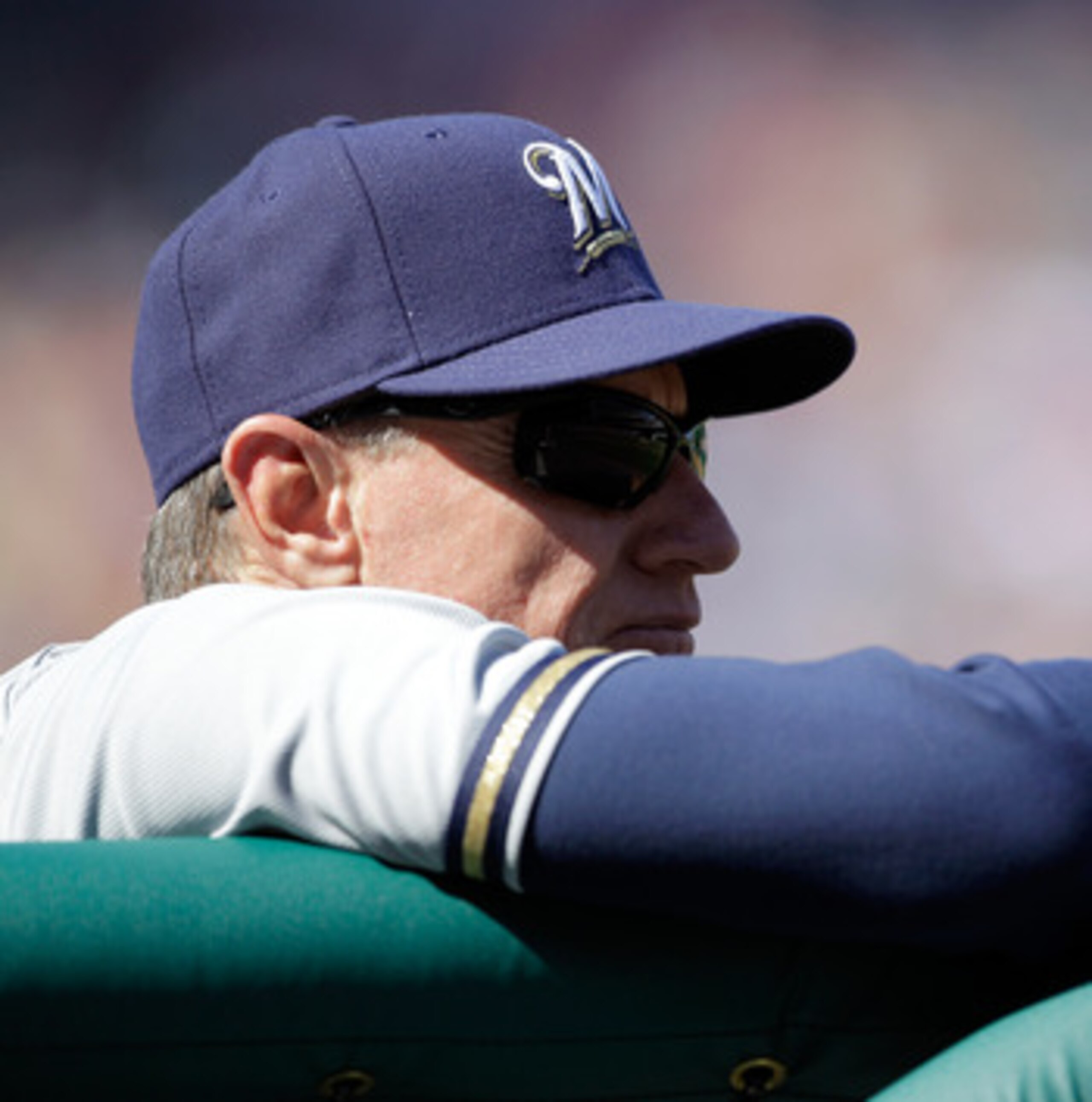 WASHINGTON, DC - APRIL 17: Manager  Ron Roenicke #10 of the Milwaukee Brewers looks on from the dugout against the Washington Nationals during the first game of a doubleheader at Nationals Park on April 17, 2011 in Washington, DC.  (Photo by Rob Carr/Gett