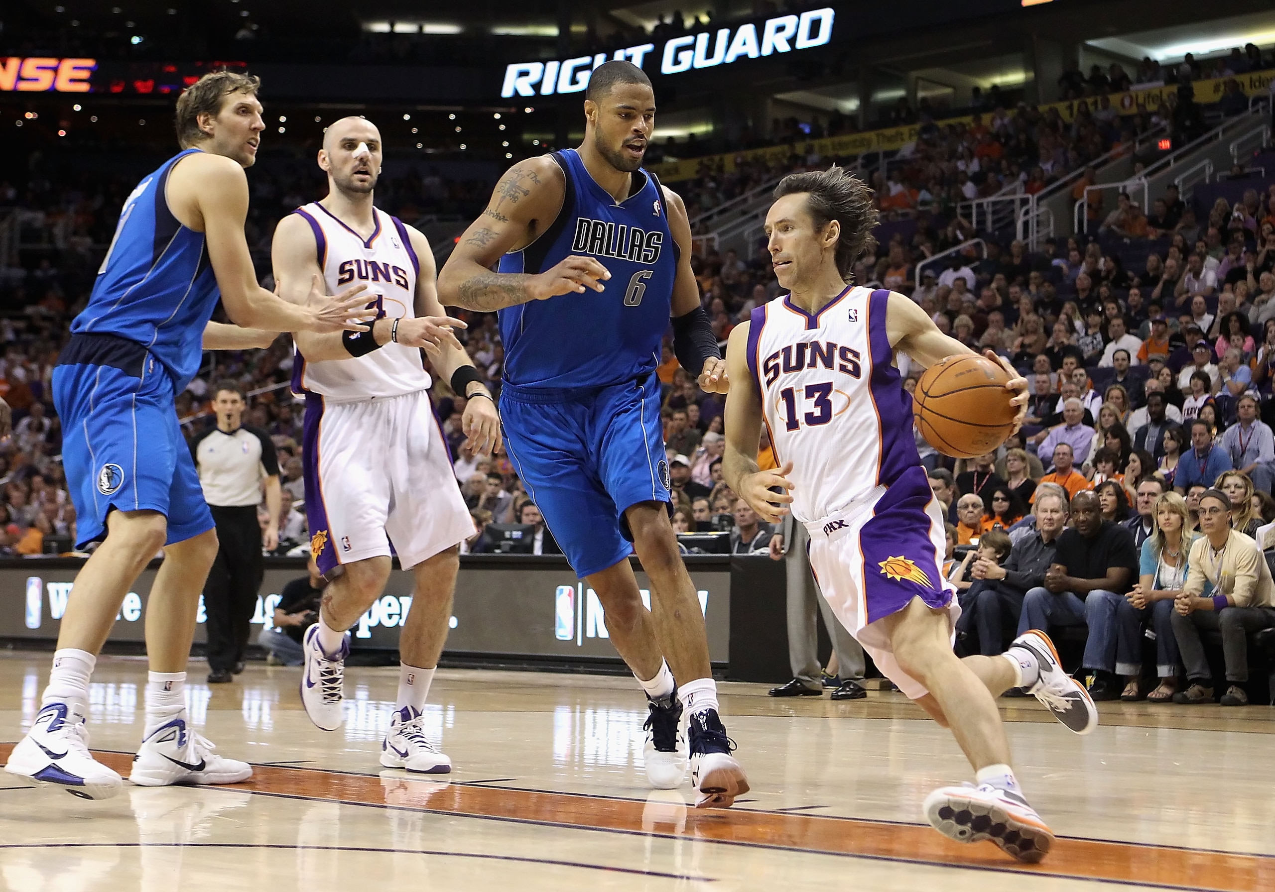 PHOENIX, AZ - MARCH 27:  Steve Nash #13 of the Phoenix Suns drives the ball past Tyson Chandler #6 of the Dallas Mavericks during the NBA game at US Airways Center on March 27, 2011 in Phoenix, Arizona.  The Mavericks defeated the Suns 91-83.  NOTE TO USE