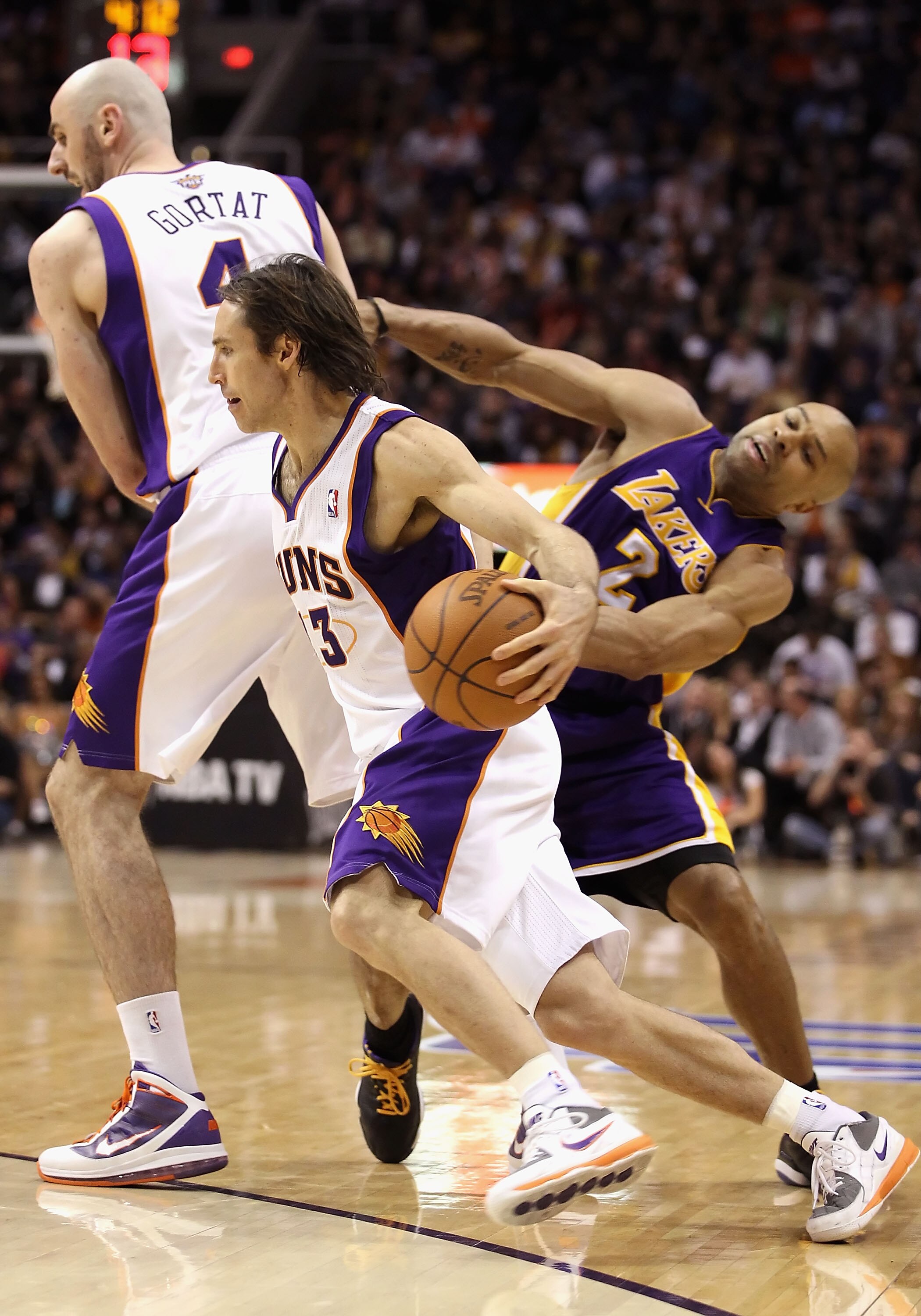 PHOENIX, AZ - JANUARY 05:  Steve Nash #13 of the Phoenix Suns handles the ball during the NBA game against the Los Angeles Lakers at US Airways Center on January 5, 2011 in Phoenix, Arizona. The Lakers defeated the Suns 99-95.  NOTE TO USER: User expressl