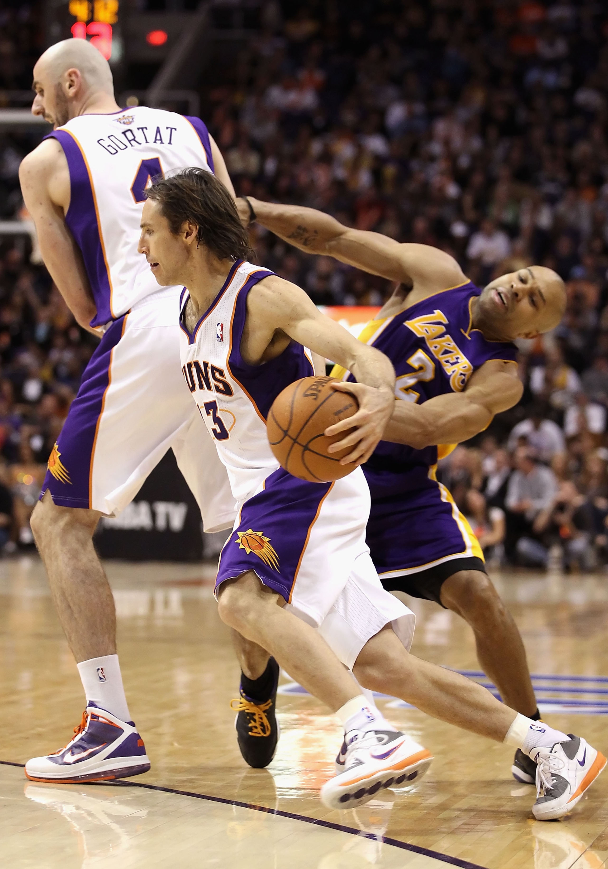 PHOENIX, AZ - JANUARY 05:  Steve Nash #13 of the Phoenix Suns handles the ball during the NBA game against the Los Angeles Lakers at US Airways Center on January 5, 2011 in Phoenix, Arizona. The Lakers defeated the Suns 99-95.  NOTE TO USER: User expressl