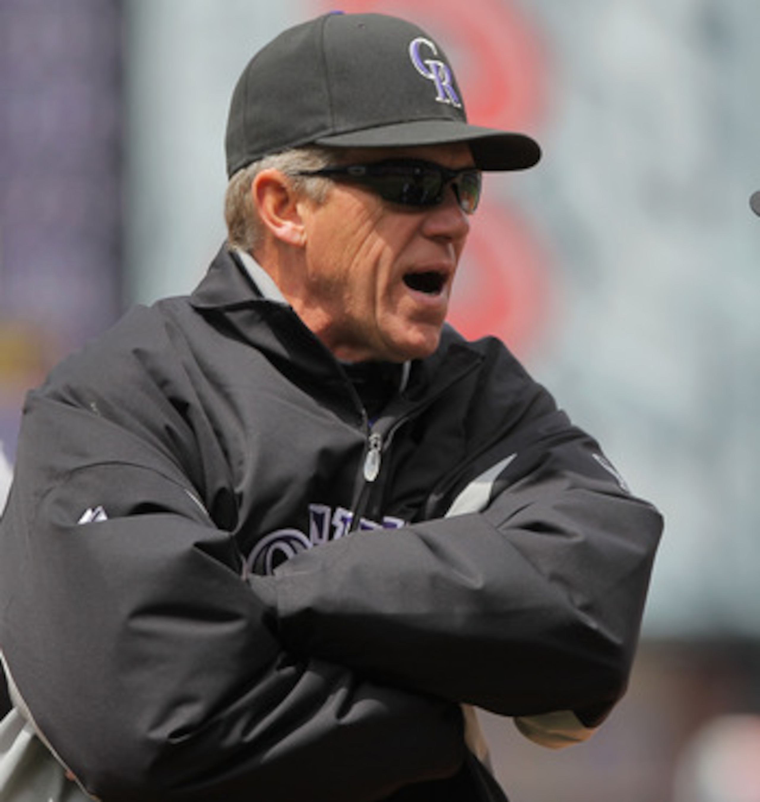 DENVER, CO - APRIL 20:  Manager Jim Tracy (L) of the Colorado Rockies protests a call by firstbase umpire Ed Hickox when he called Aubrey Huff of the San Francisco Giants safe at first on an attempted double play at Coors Field on April 20, 2011 in Denver
