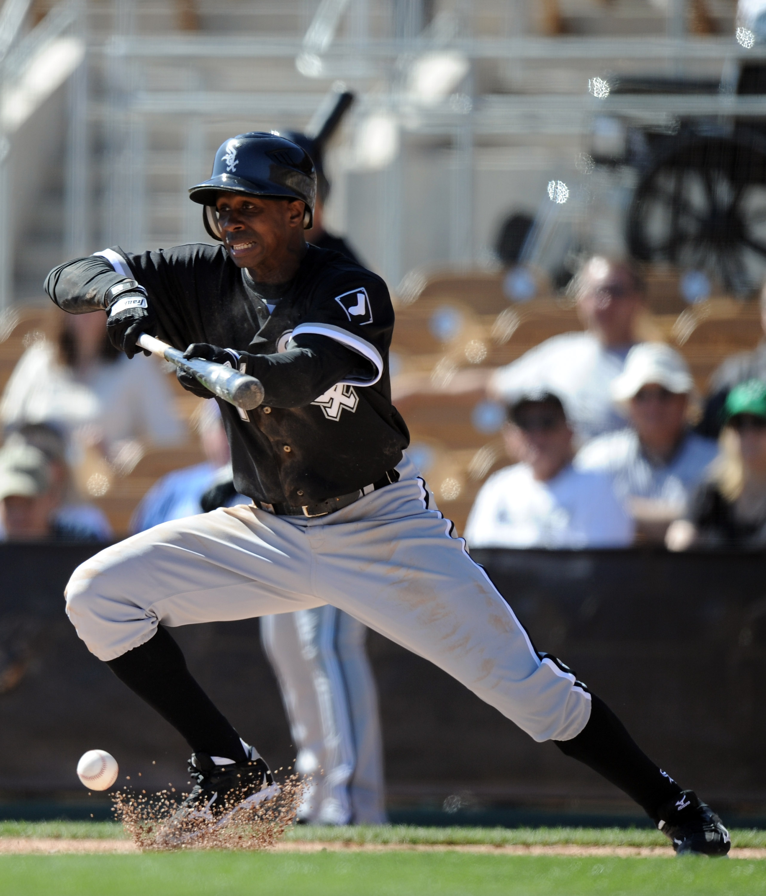 Marlins outfielder Juan Pierre bunting for a hit.