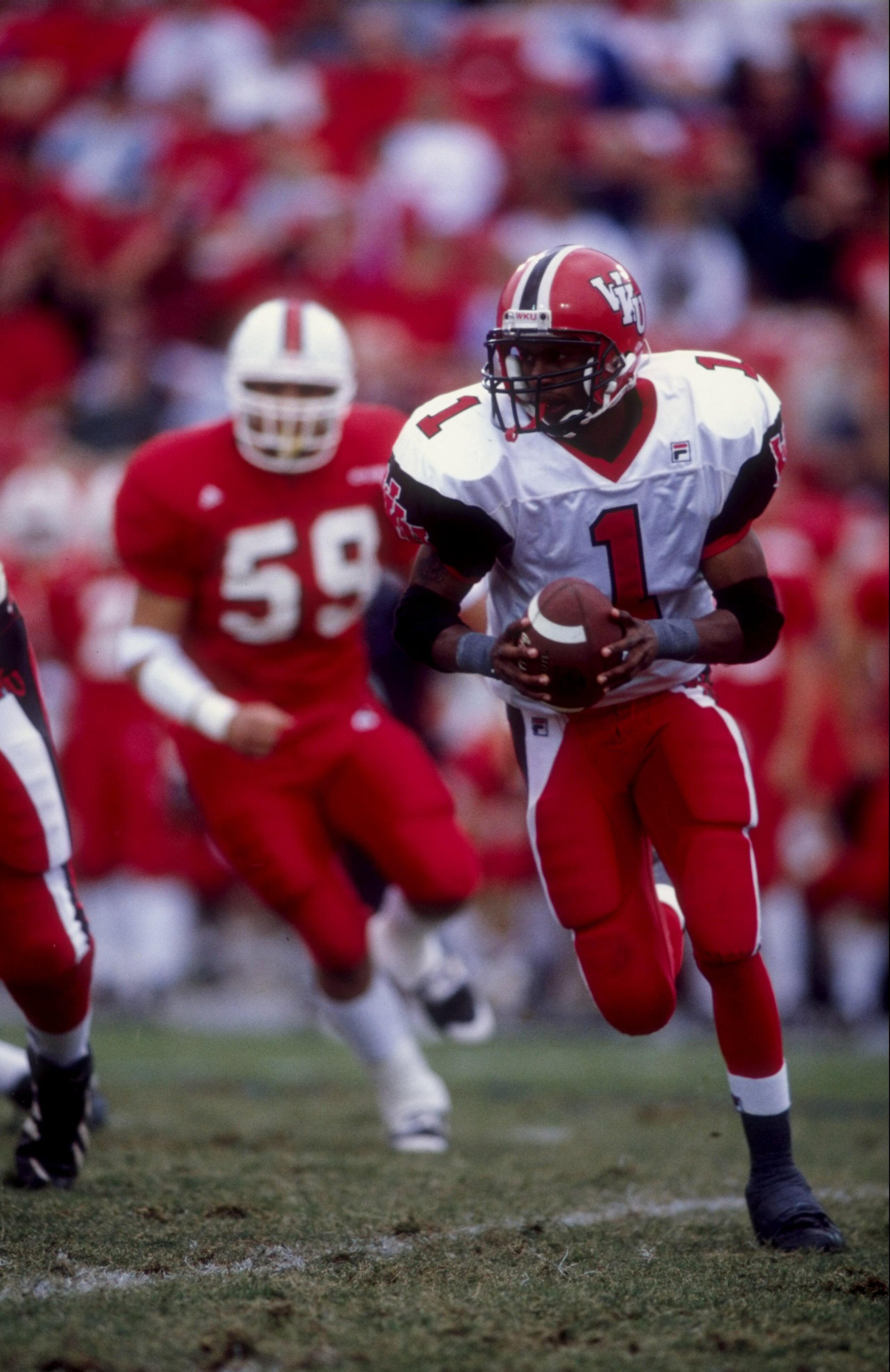 31 Oct 1998:  Quarterback Willie Taggart #1 of the Western Kentucky Hilltoppers in action during the game against the Louisville Cardinals at the Papa John''s Cardinal Stadium in Louisville, Kentucky. The Cardinals defeated the Hilltoppers 63-34. Mandator