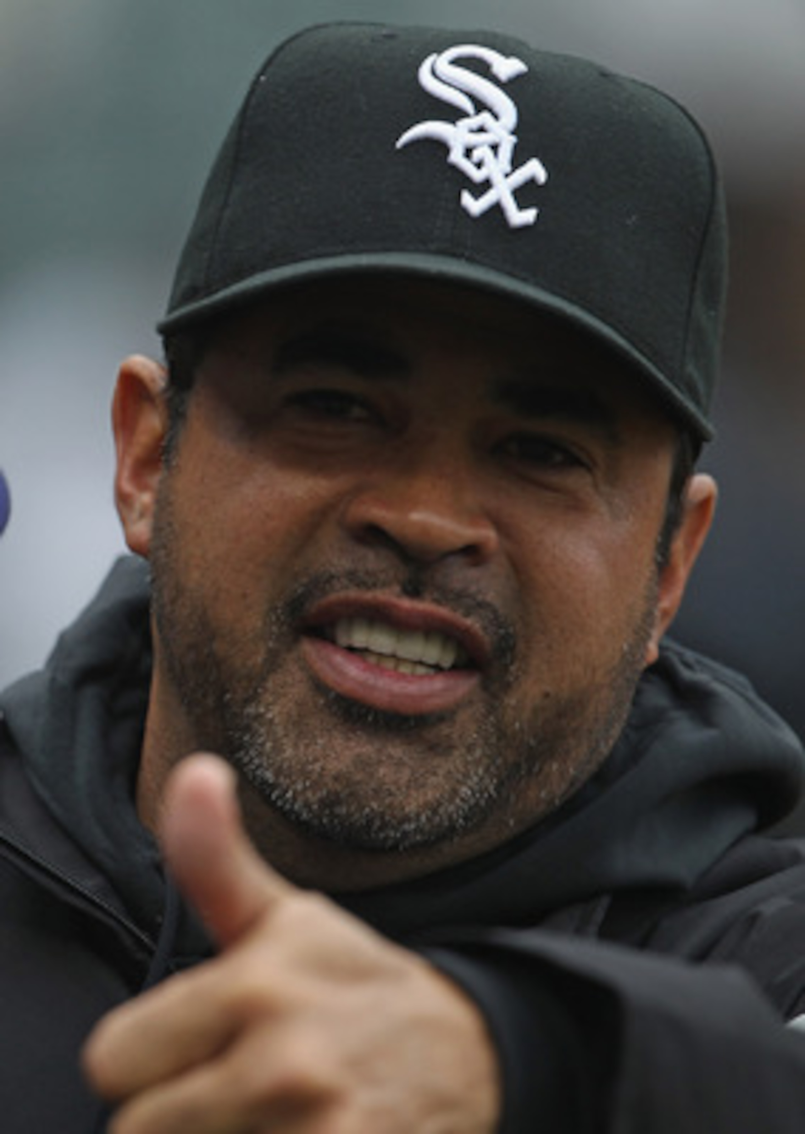 CHICAGO, IL - APRIL 07: Manager Ozzie Guillen #13 of the Chicago White Sox gives a 'thumbs up' to members of the Tampa Bay Rays before the home opener at U.S. Cellular Field on April 7, 2011 in Chicago, Illinois. (Photo by Jonathan Daniel/Getty Images)