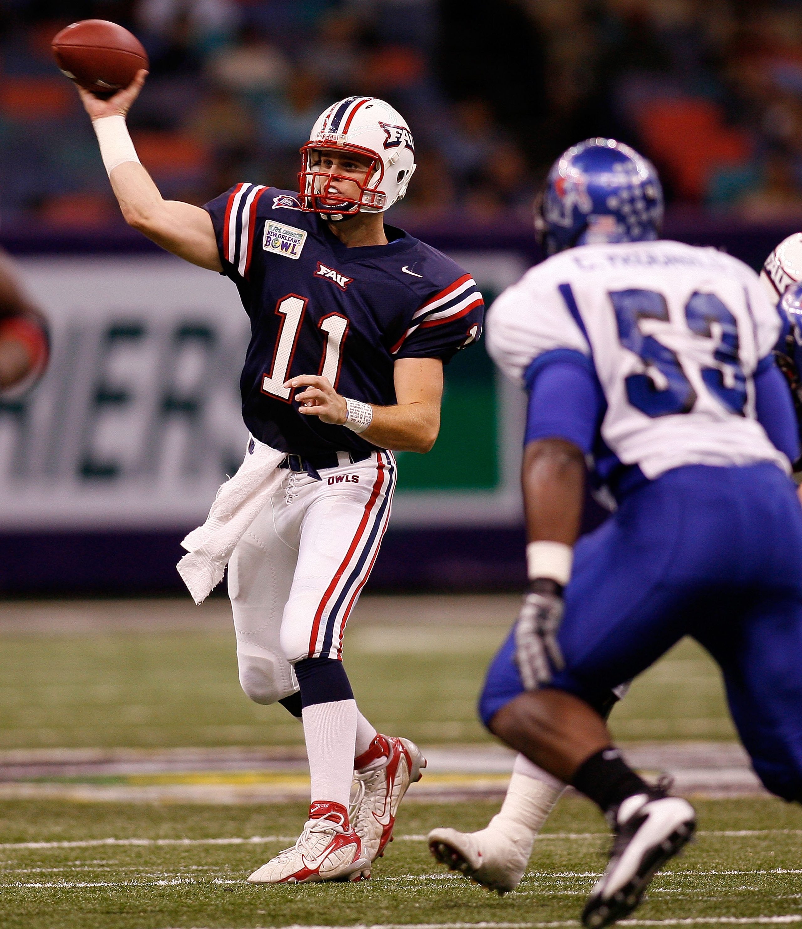 NEW ORLEANS - DECEMBER 21: Quarterback Rusty Smith #11 of the Florida Atlantic University Owls throws a pass over Clinton McDonald #53 of the Memphis University Tigers on his way to scoring a touchdown in the New Orleans Bowl on December 21, 2007 at the L