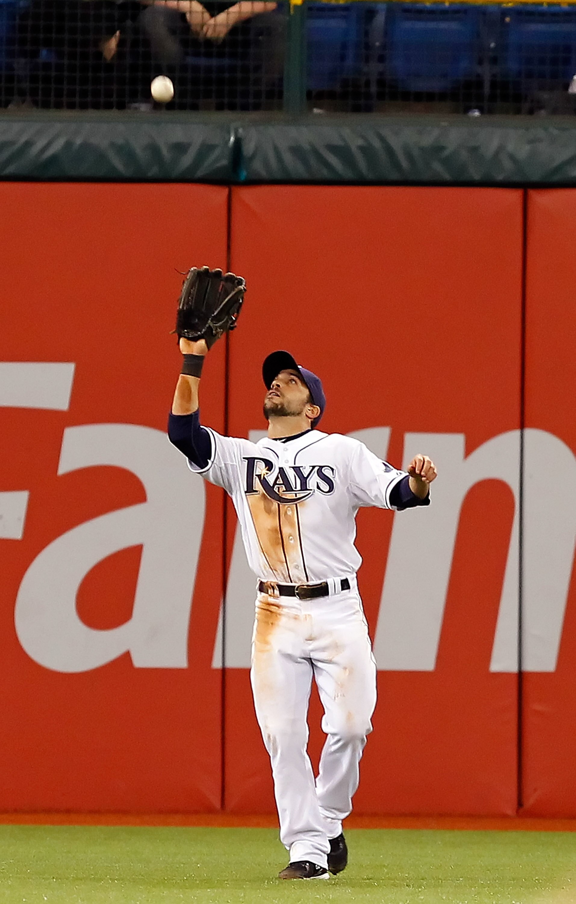 ST. PETERSBURG, FL - APRIL 18:  Outfielder Sam Fuld #5 of the Tampa Bay Rays catches a fly ball against the Chicago White Sox during the game at Tropicana Field on April 18, 2011 in St. Petersburg, Florida.  (Photo by J. Meric/Getty Images)