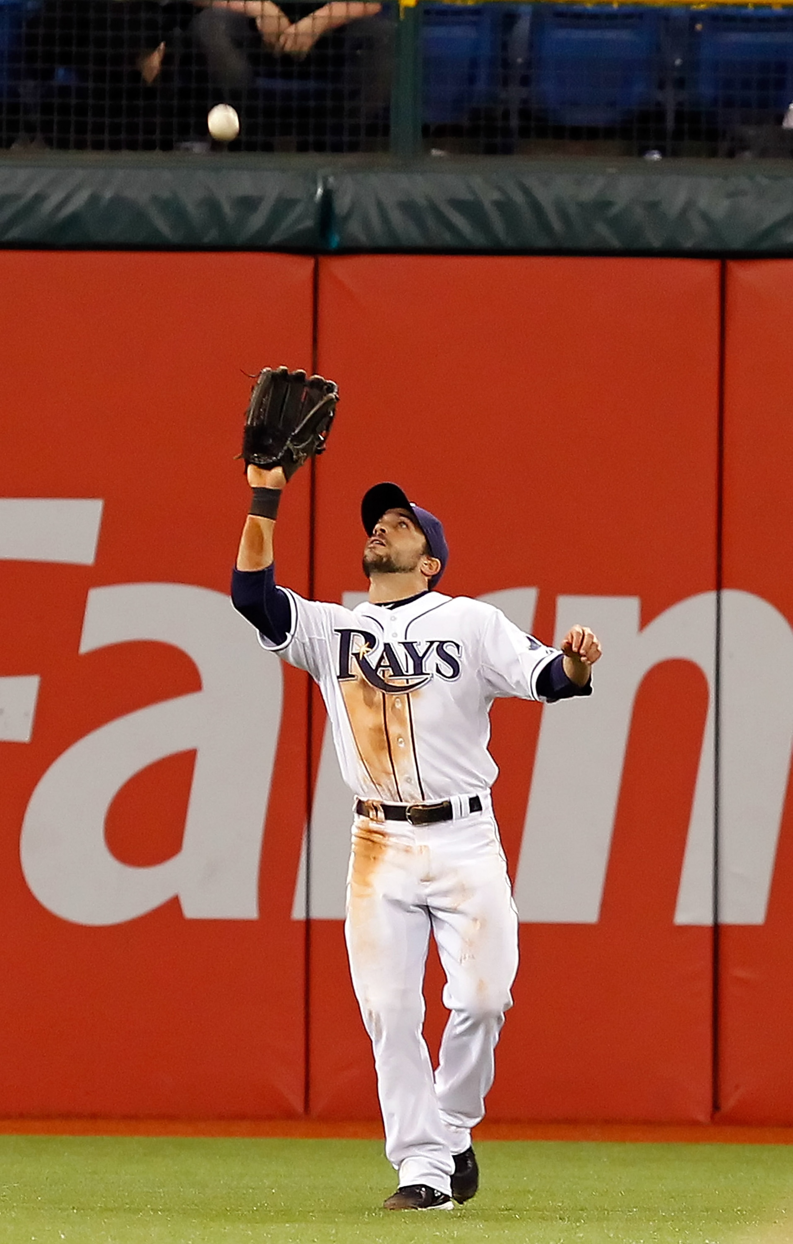 ST. PETERSBURG, FL - APRIL 18:  Outfielder Sam Fuld #5 of the Tampa Bay Rays catches a fly ball against the Chicago White Sox during the game at Tropicana Field on April 18, 2011 in St. Petersburg, Florida.  (Photo by J. Meric/Getty Images)