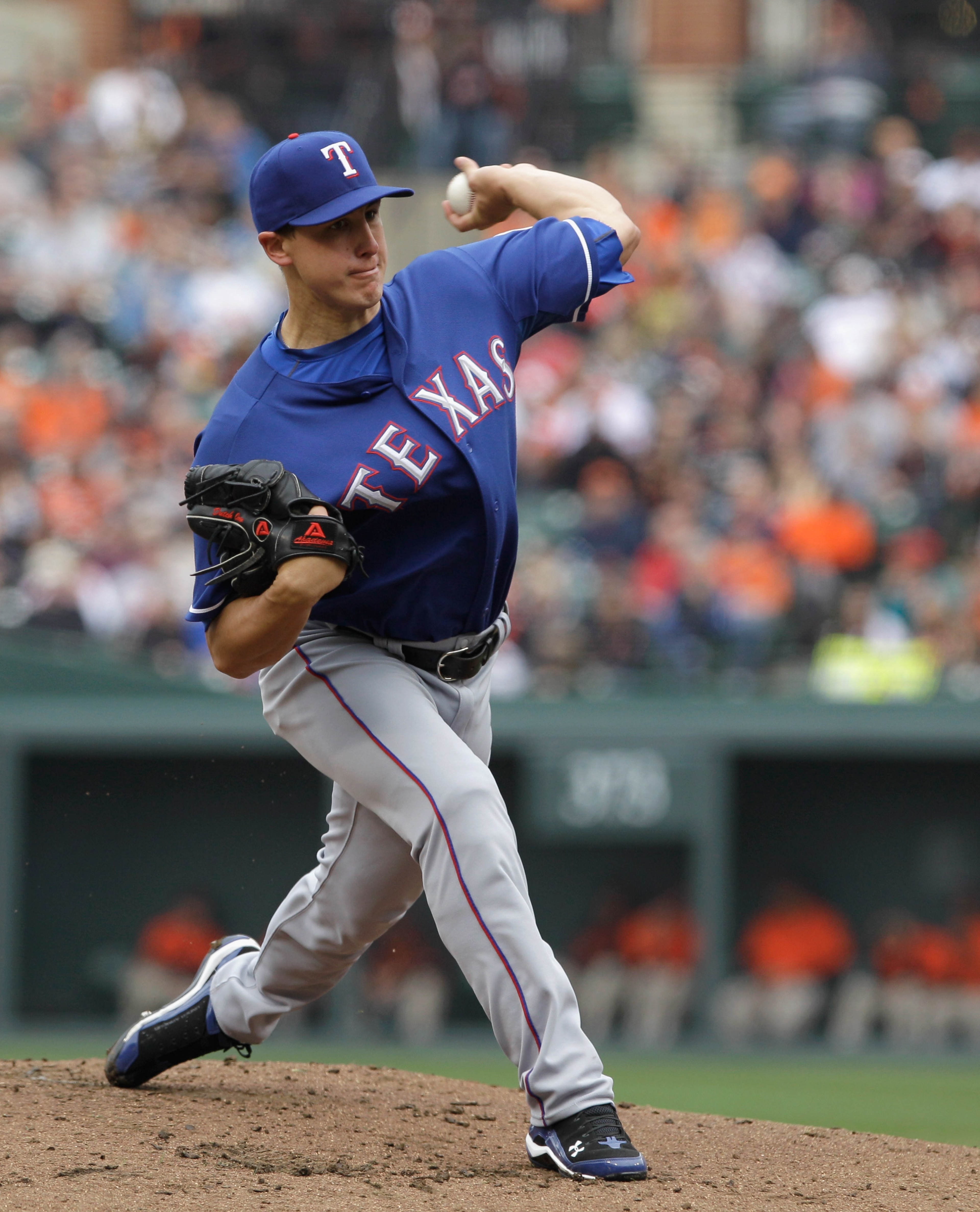 BALTIMORE, MD - APRIL 10: Starting pitcher Derek Holland #45 of the Texas Rangers delivers to a Baltimore Orioles batter at Oriole Park at Camden Yards on April 10, 2011 in Baltimore, Maryland. (Photo by Rob Carr/Getty Images) BALTIMORE, MD - APRIL 10: Starting pitcher Derek Holland #45 of the Texas Rangers delivers to a Baltimore Orioles batter at Oriole Park at Camden Yards on April 10, 2011 in Baltimore, Maryland. (Photo by Rob Carr/Getty Images)