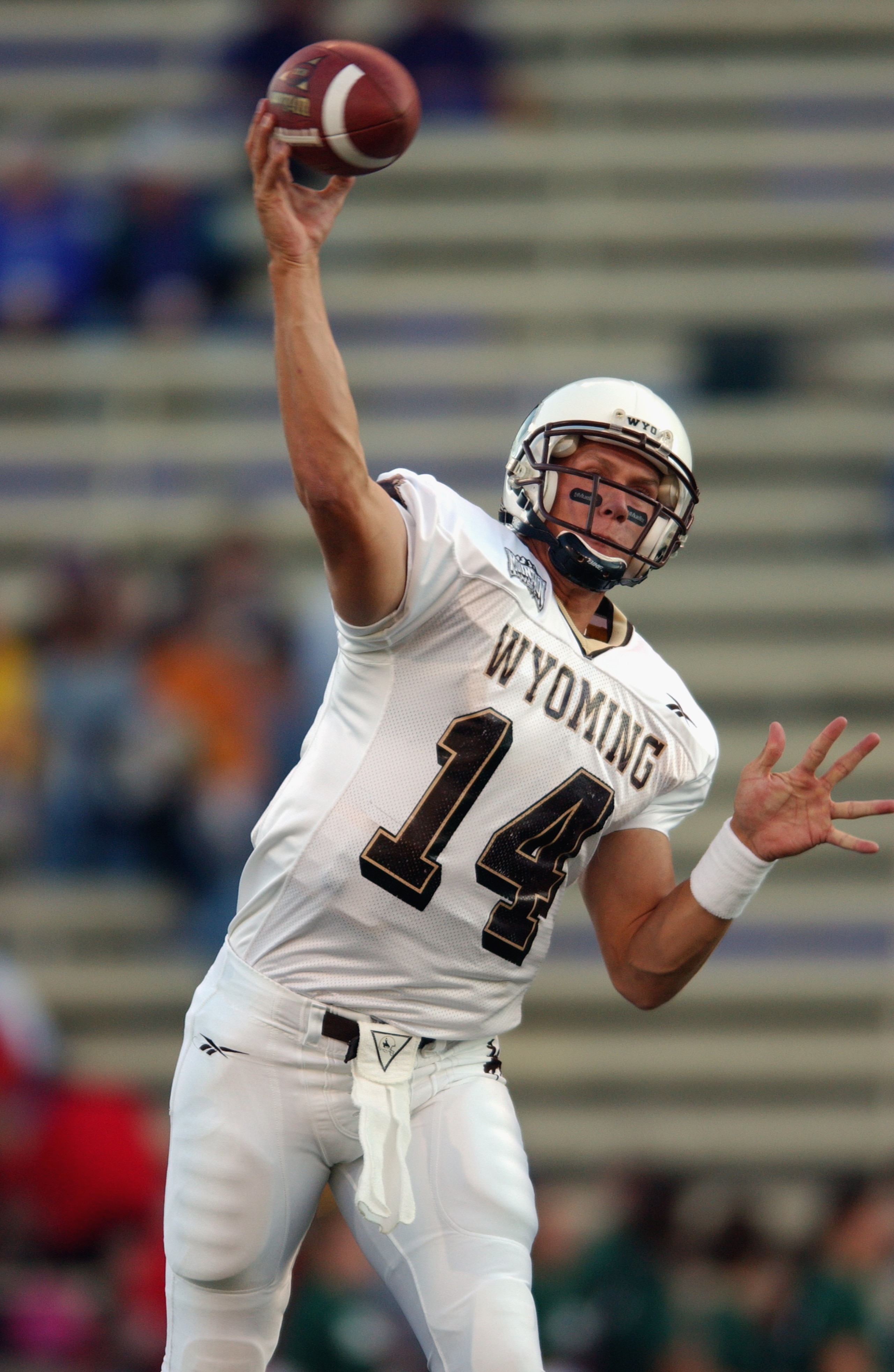 SEATTLE - SEPTEMBER 21:  Quarterback Casey Bramlet #14 of the Wyoming Cowboys warms up before the NCAA football game against the Washington Huskies on September 21, 2002 at Husky Stadium in Seattle, Washington.  The Huskies won 38-7.  (Photo by Otto Greul