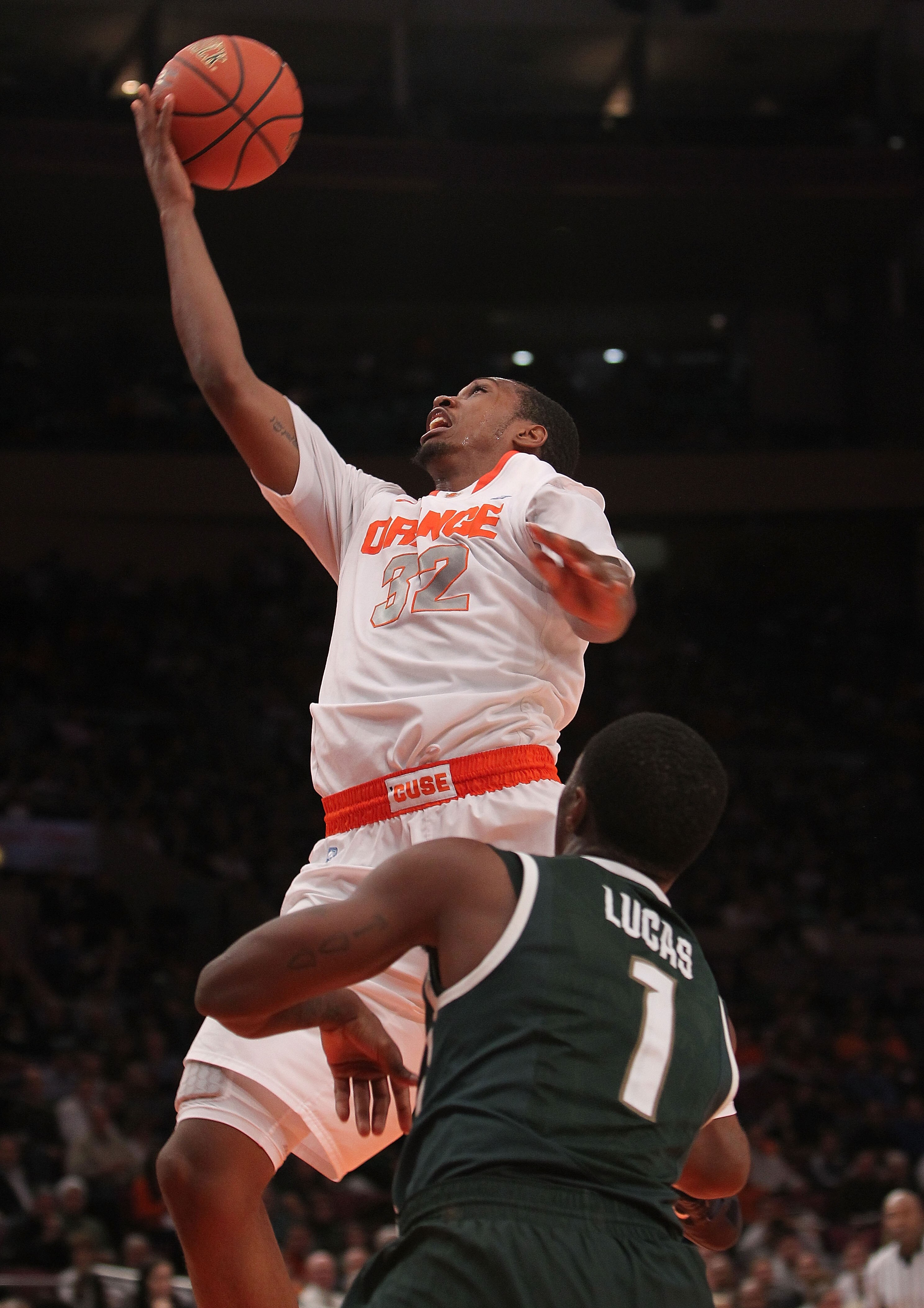 NEW YORK, NY - DECEMBER 07: Kris Joseph #32 of Syracuse Orange lays the ball up against the Michigan State Spartans during their game at the Jimmy V Classic at Madison Square Garden on December 7, 2010 in New York City.  (Photo by Nick Laham/Getty Images)