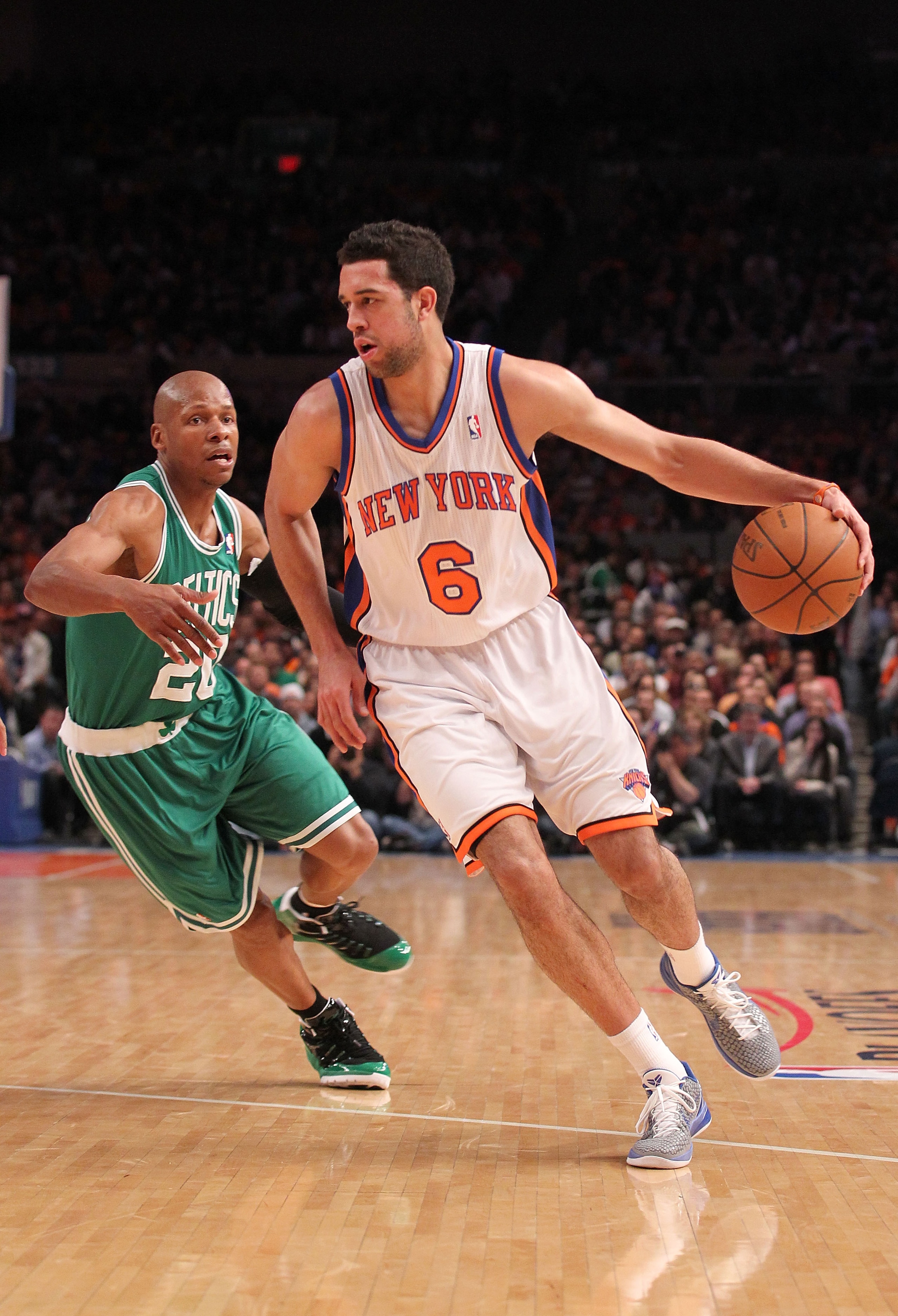 NEW YORK, NY - APRIL 22:  Landry Fields #6 of the New York Knicks drives against Ray Allen #20 of the Boston Celtics in Game Three of the Eastern Conference Quarterfinals in the 2011 NBA Playoffs on April 22, 2011 at Madison Square Garden in New York City