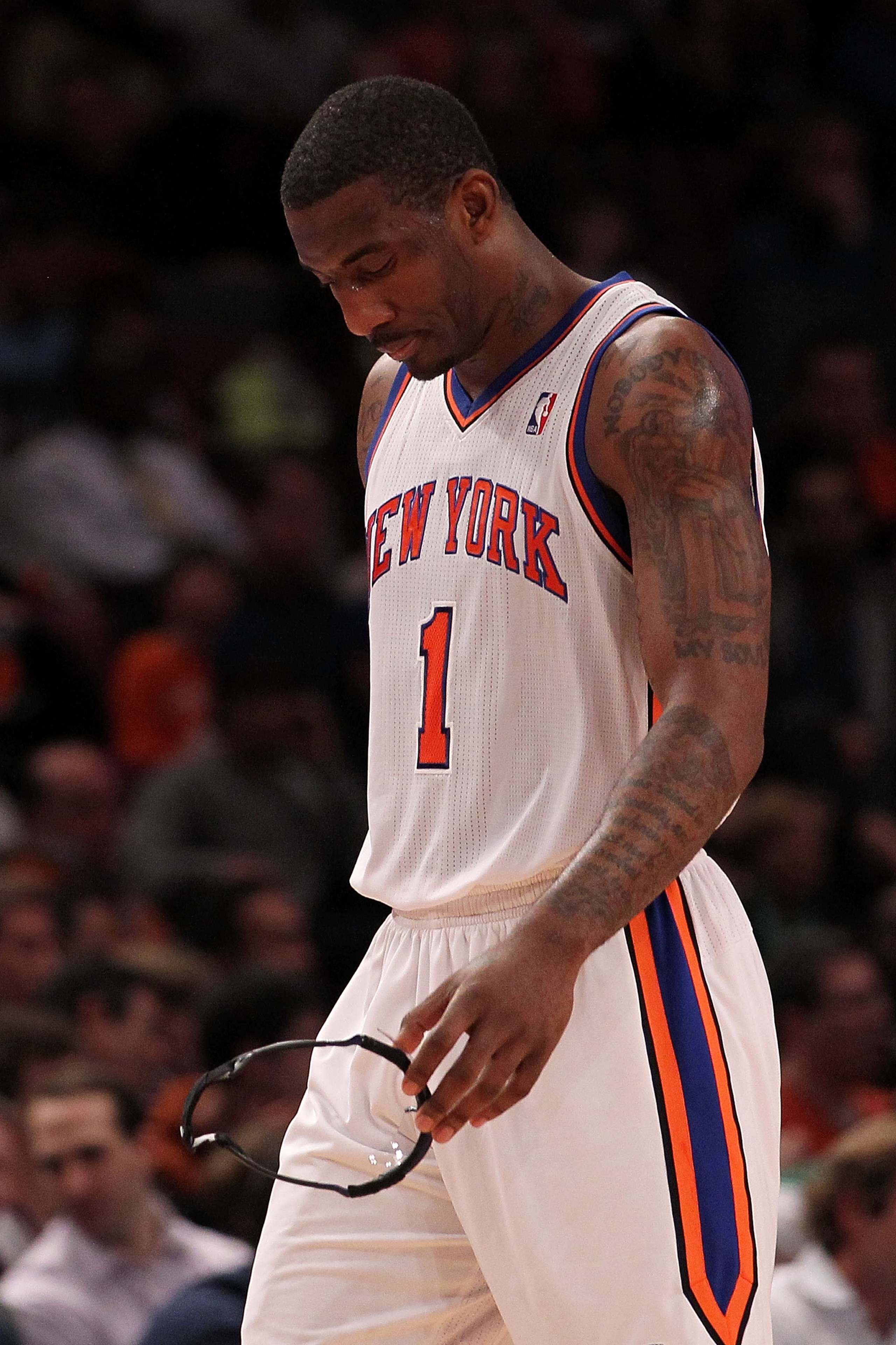 NEW YORK, NY - APRIL 22:  Amar'e Stoudemire #1 of the New York Knicks walks towards the bench with his head down against the Boston Celtics in Game Three of the Eastern Conference Quarterfinals in the 2011 NBA Playoffs on April 22, 2011 at Madison Square