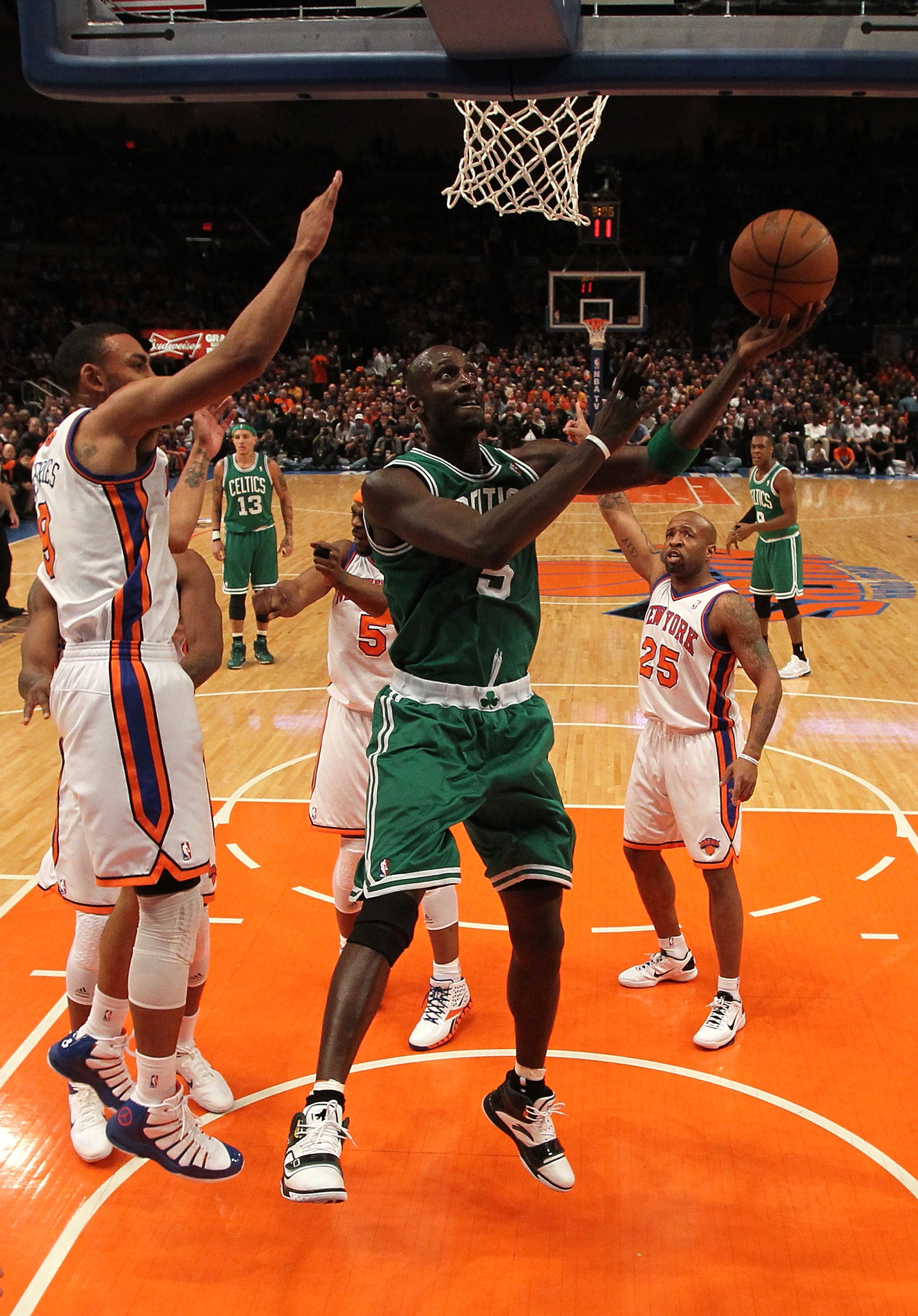 NEW YORK, NY - APRIL 22:  Kevin Garnett #5 of the Boston Celtics attempts a shot against Jared Jeffries #9 of the New York Knicks in Game Three of the Eastern Conference Quarterfinals in the 2011 NBA Playoffs on April 22, 2011 at Madison Square Garden in